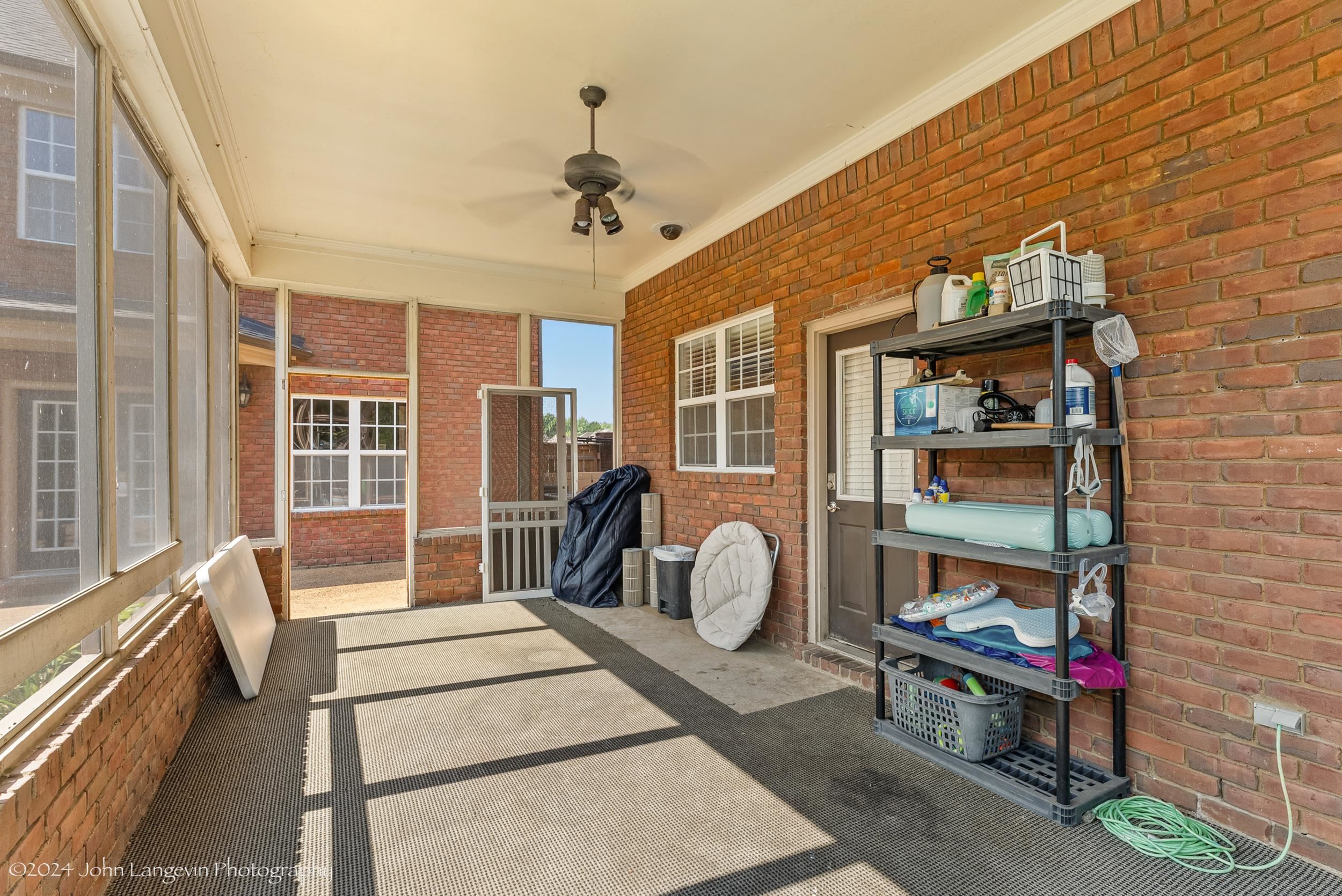 Exterior space featuring ceiling fan