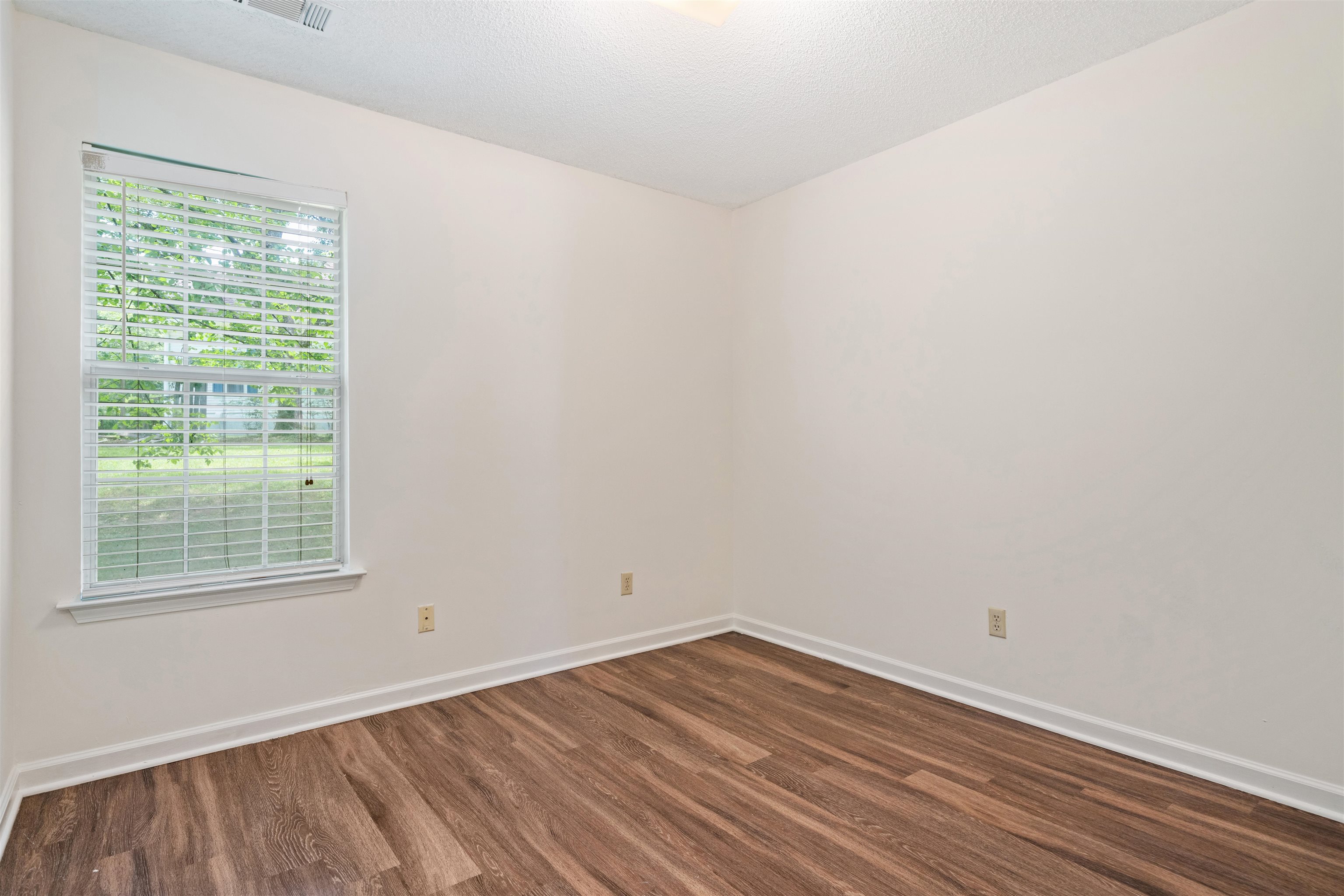 Bedroom 2 with wood-type flooring