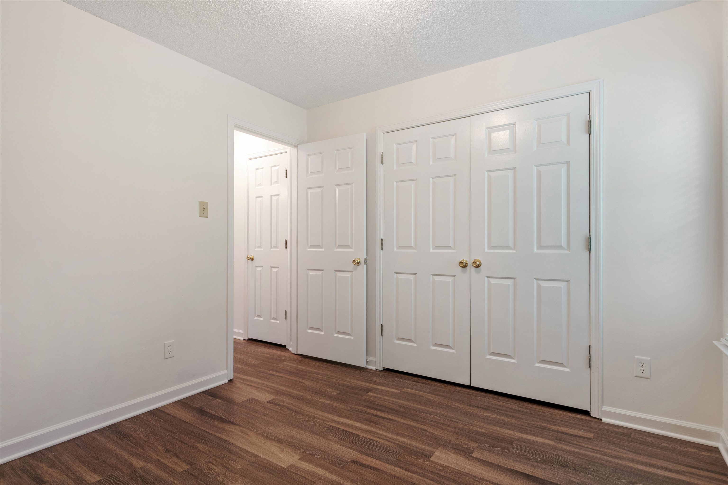 Bedroom 2 featuring dark hardwood / wood-style flooring