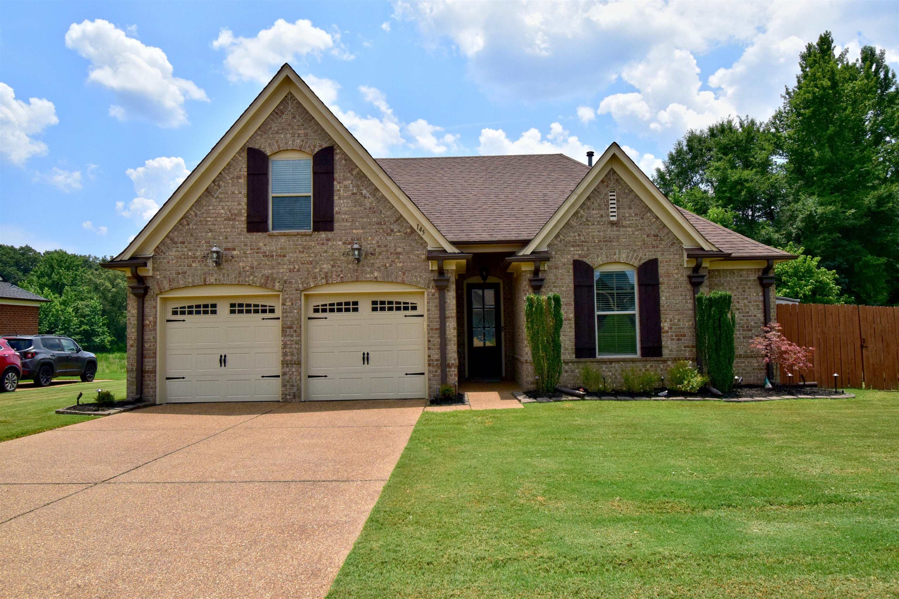 This well-maintained home offers an energy efficient/low-maintenance brick exterior, a 2-car garage, professional landscaping plus a covered entrance.