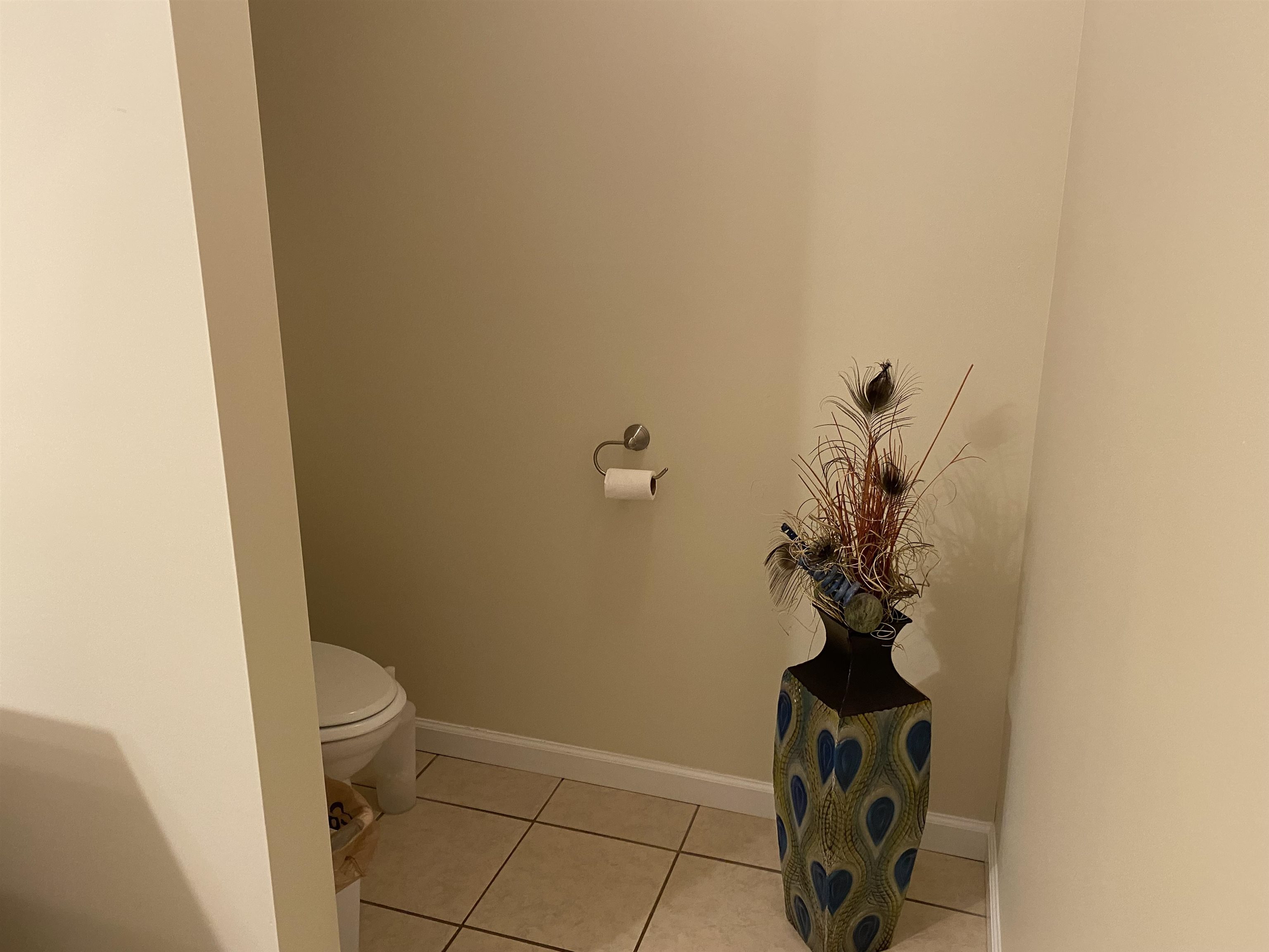 Bathroom featuring tile patterned floors and toilet