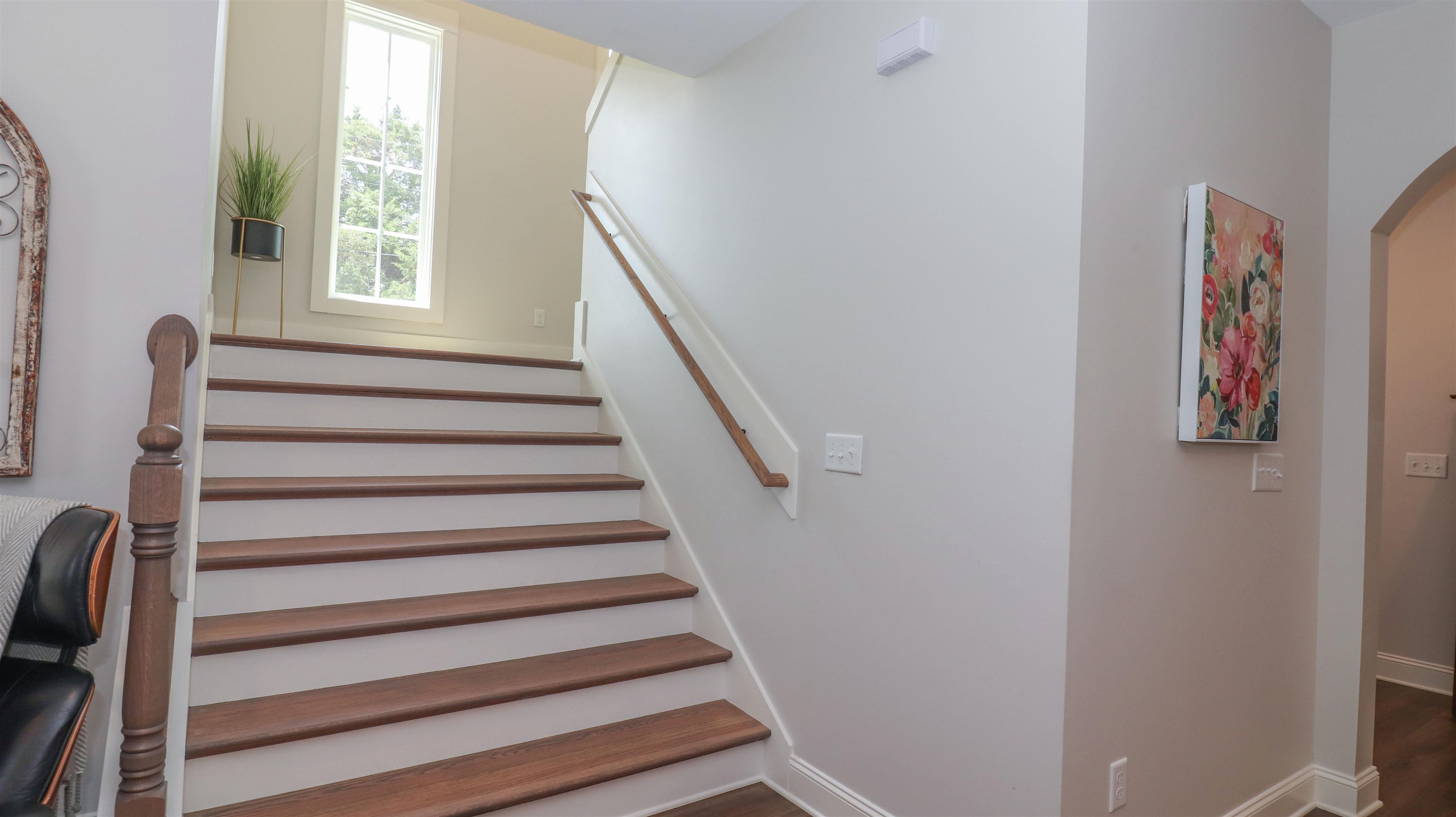 Stairway with hardwood / wood-style floors