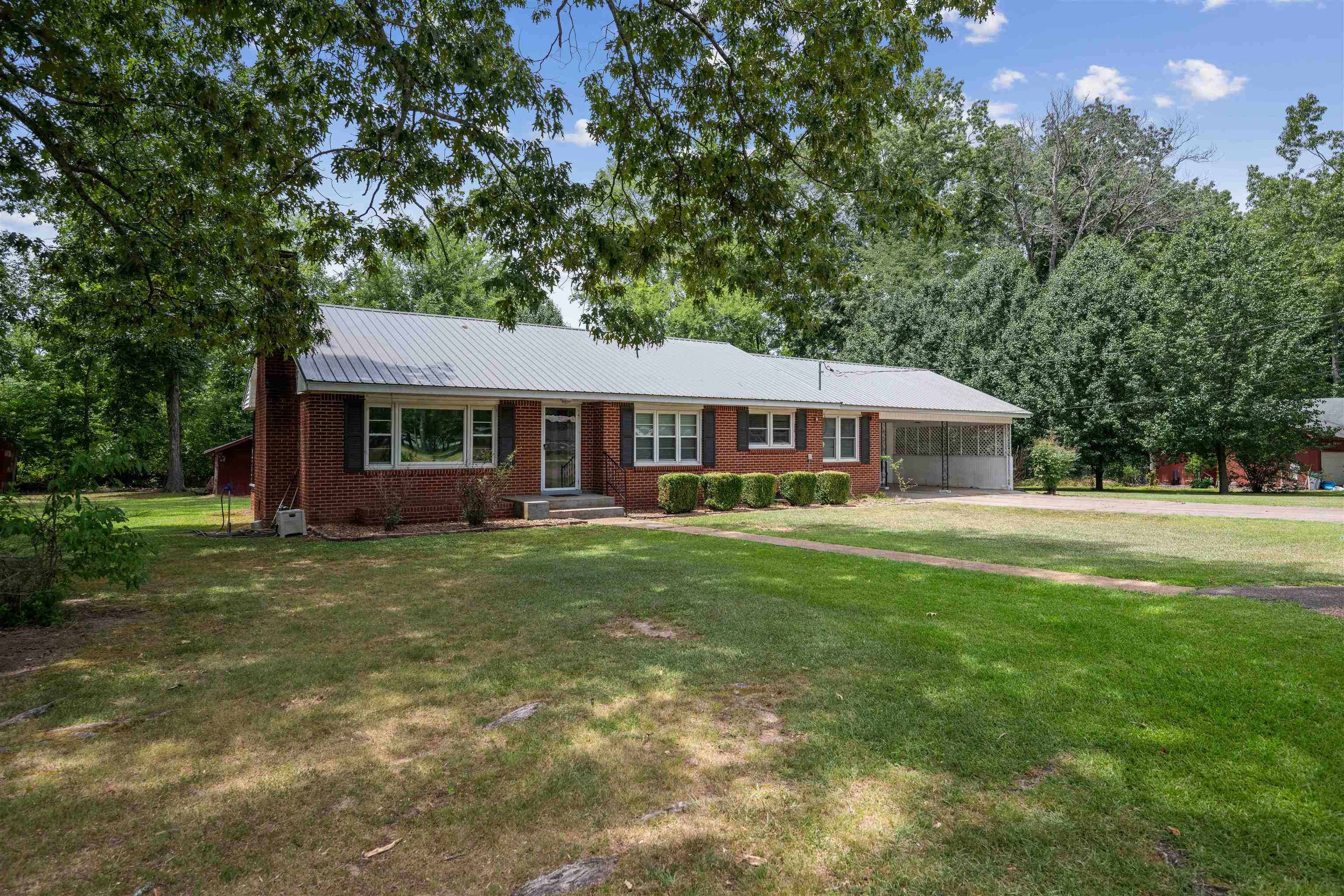 Single story home featuring a front yard