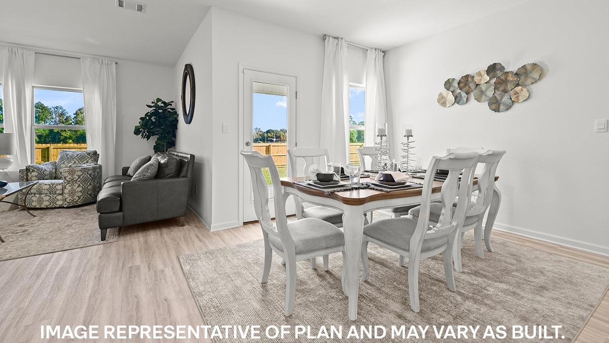 Dining area with light wood-type flooring