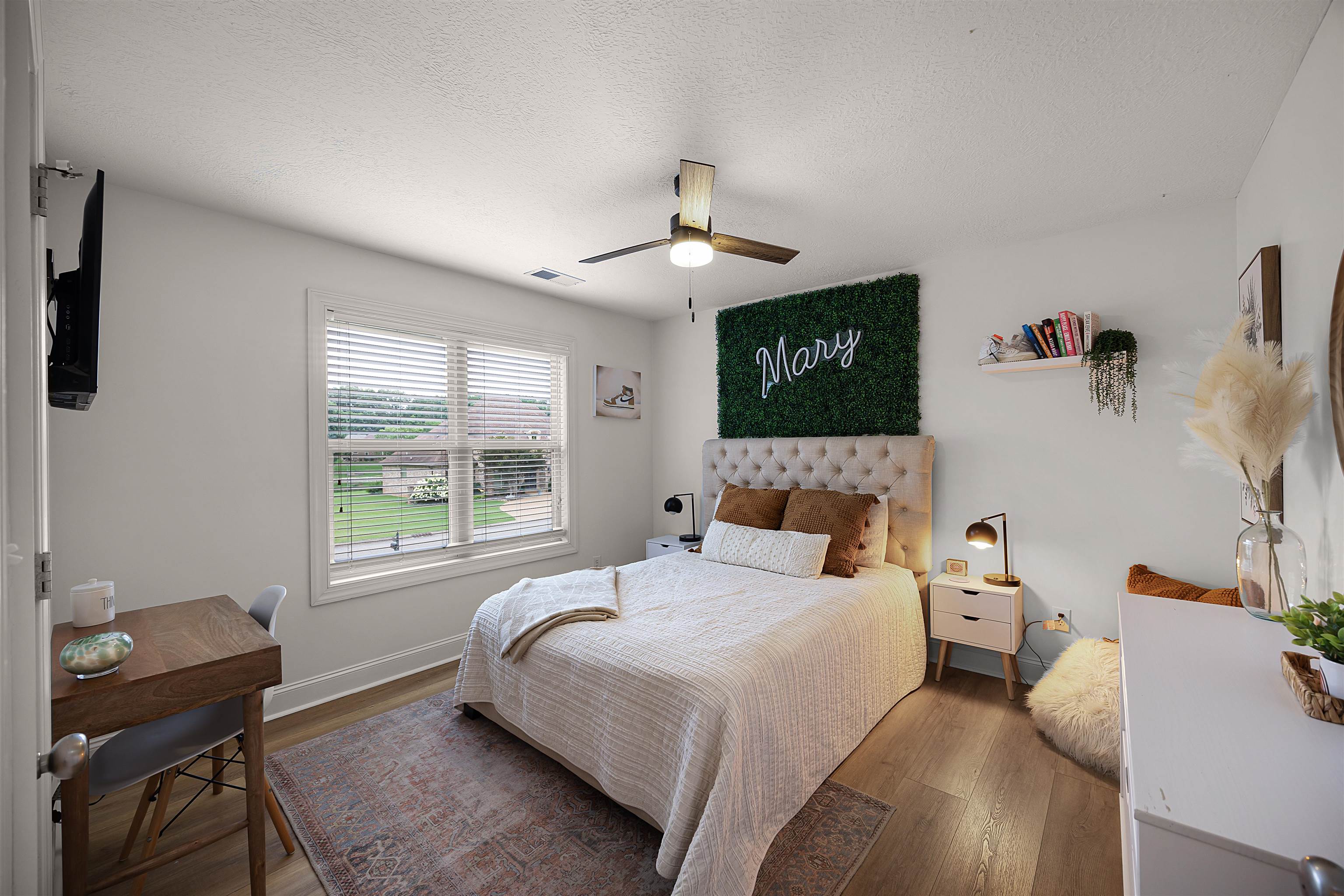 Bedroom featuring a textured ceiling, ceiling fan, and hardwood / wood-style floors