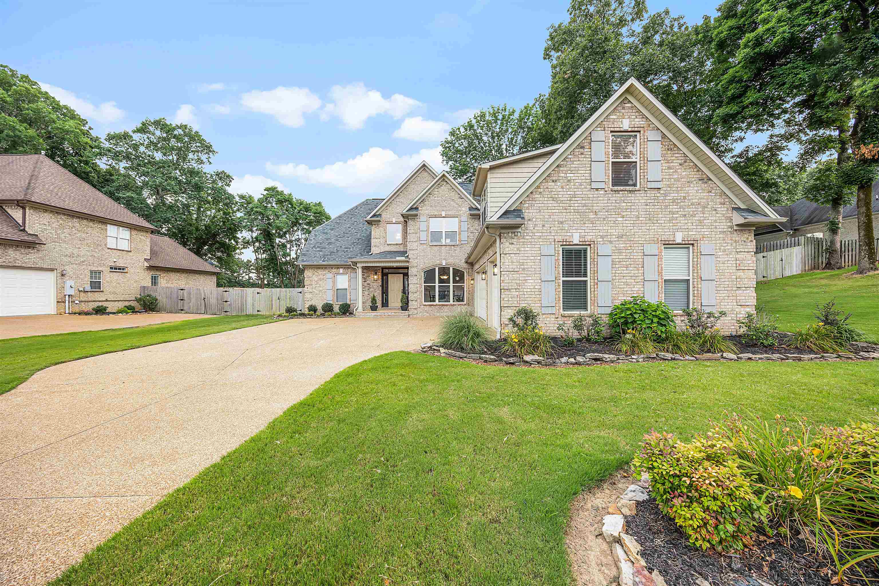 View of front of home featuring a garage and a front lawn