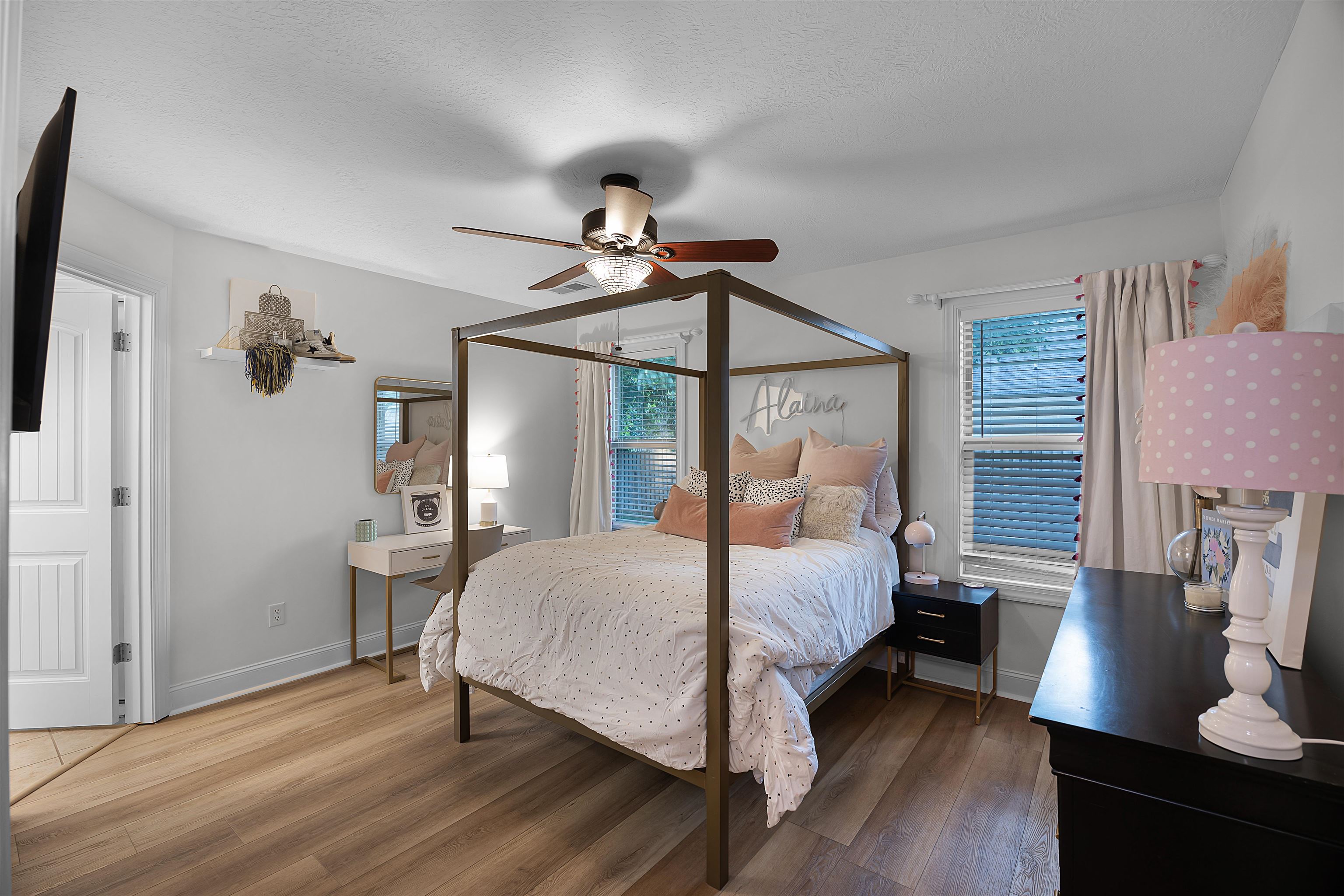Bedroom with wood-type flooring and ceiling fan