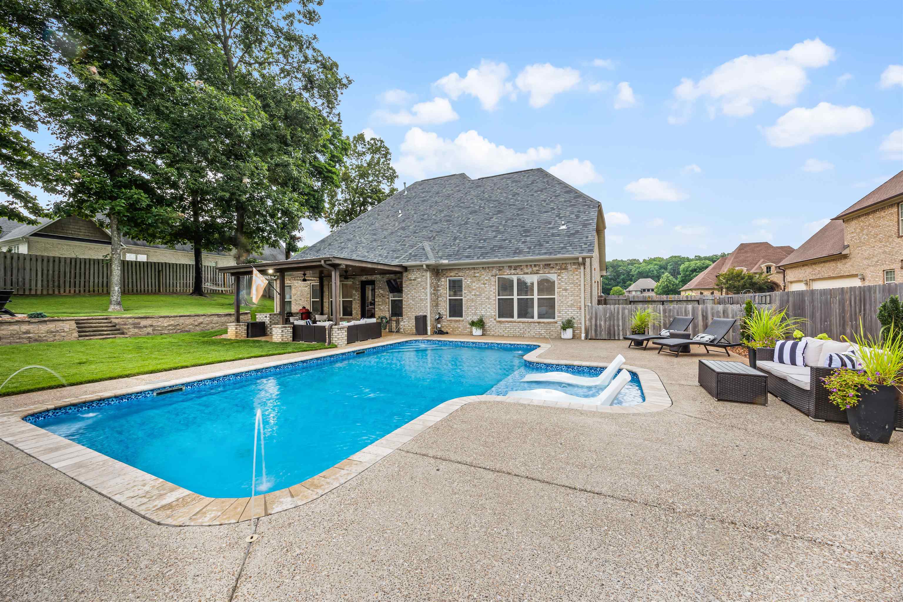 View of pool featuring outdoor lounge area, a patio, and a yard