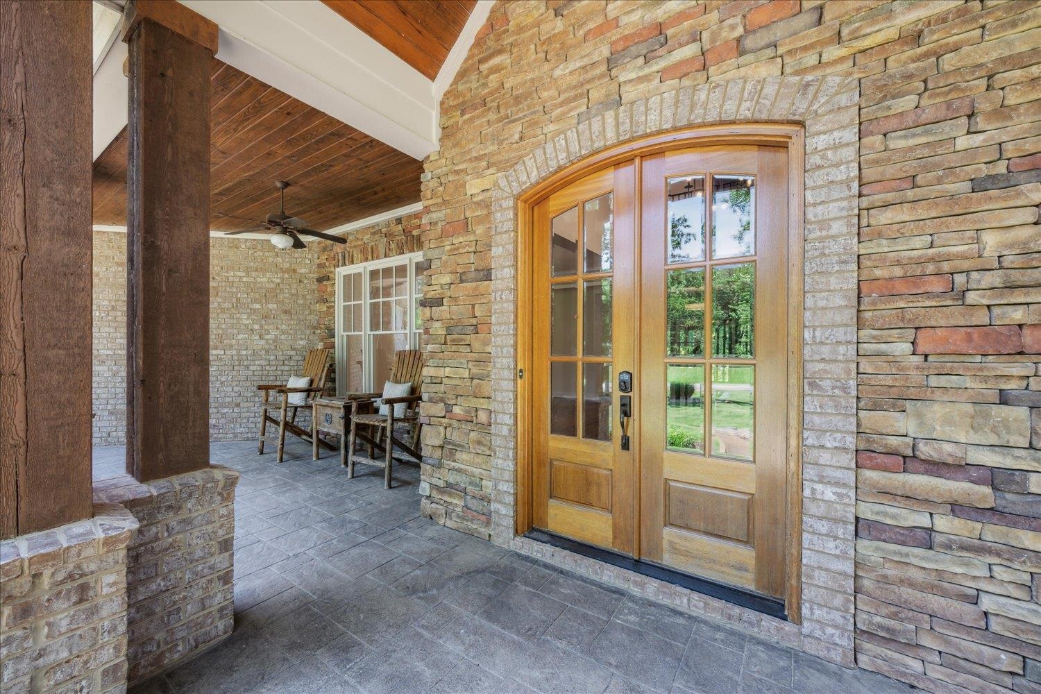 Property entrance featuring french doors and ceiling fan