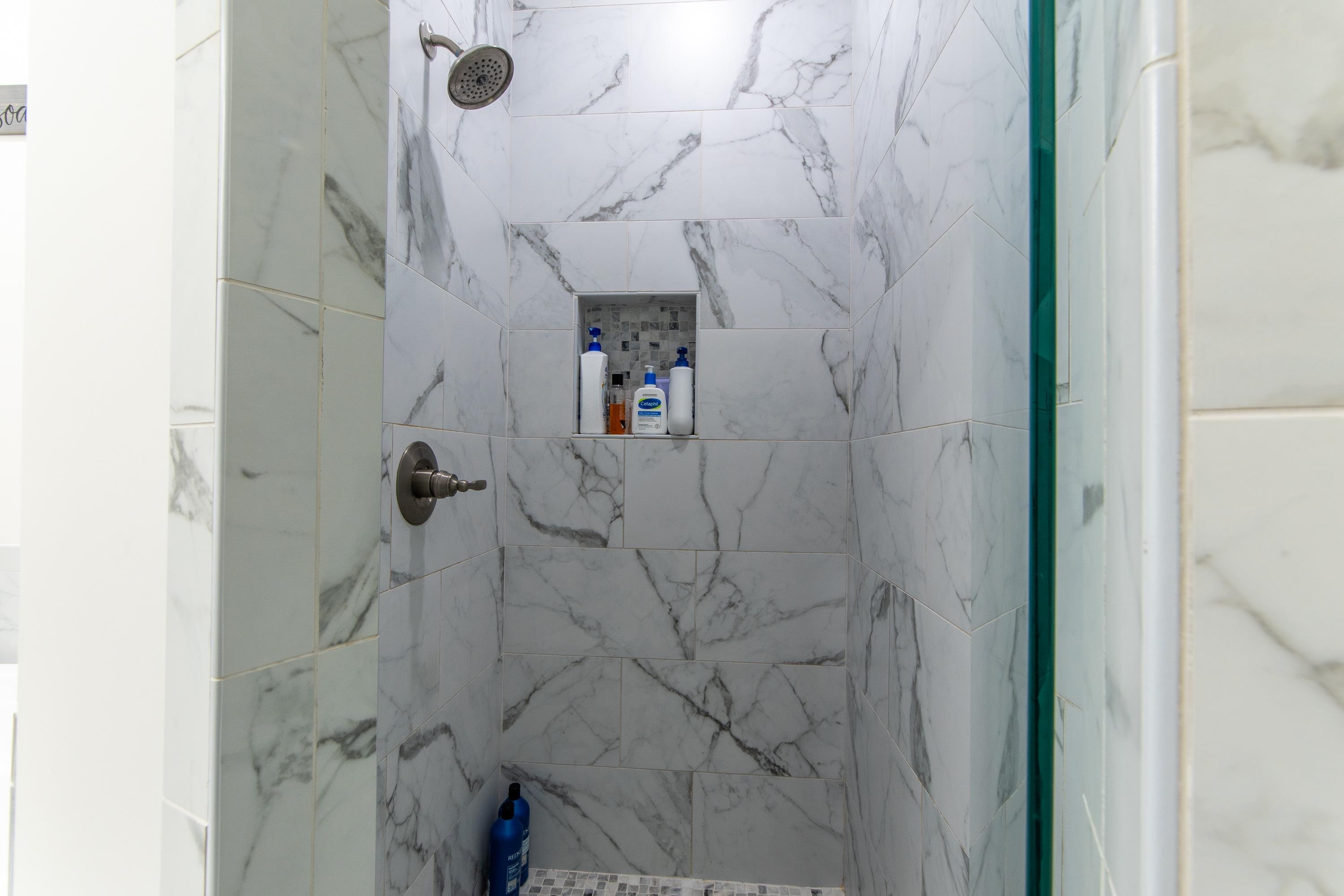 Bathroom with a tile shower