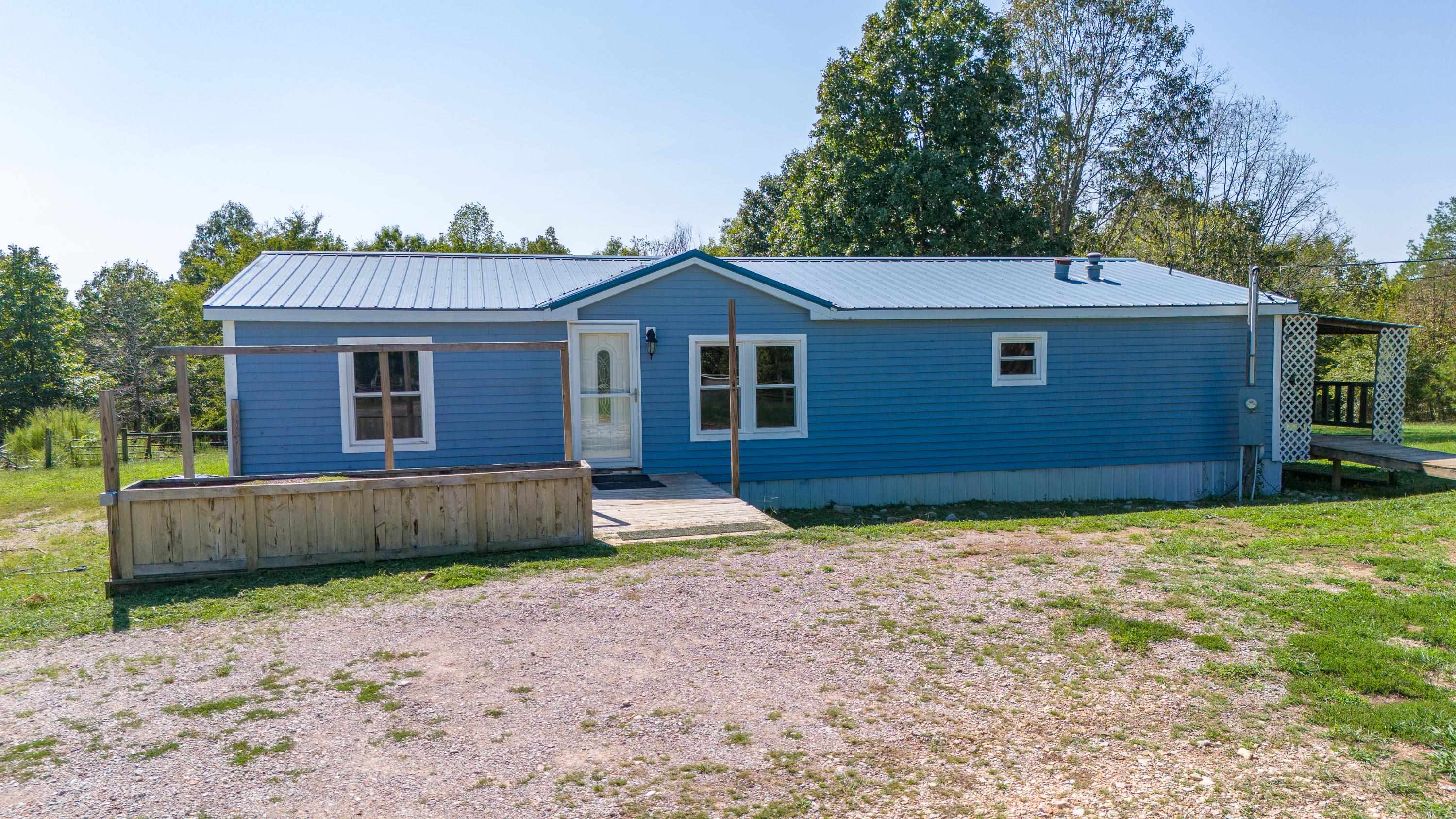 View of front of property with a front yard