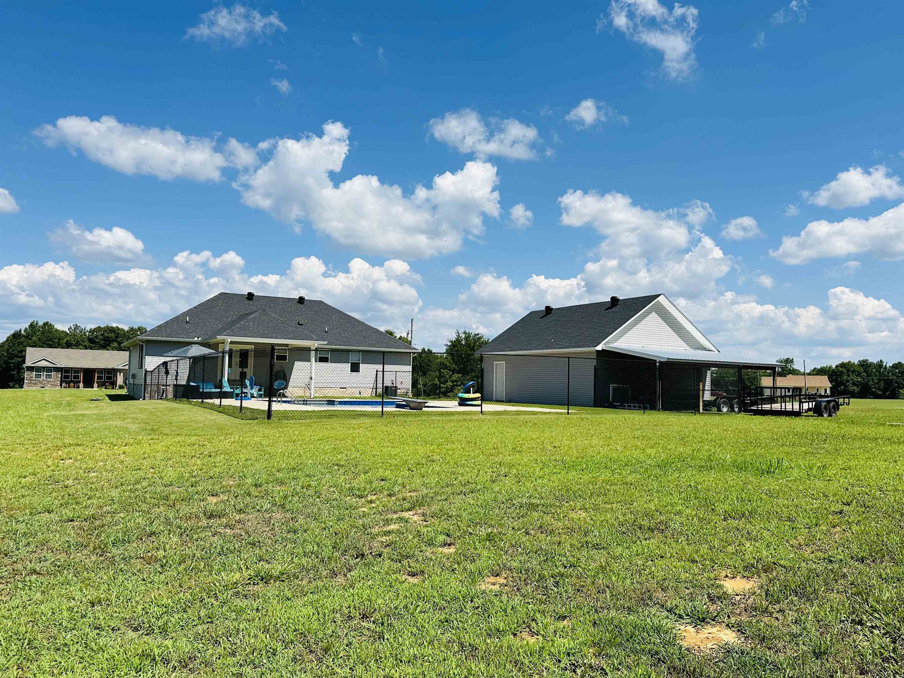 View of yard with a swimming pool