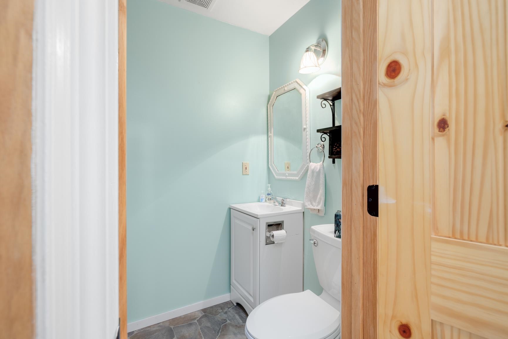 Bathroom with tile patterned flooring, toilet, and vanity