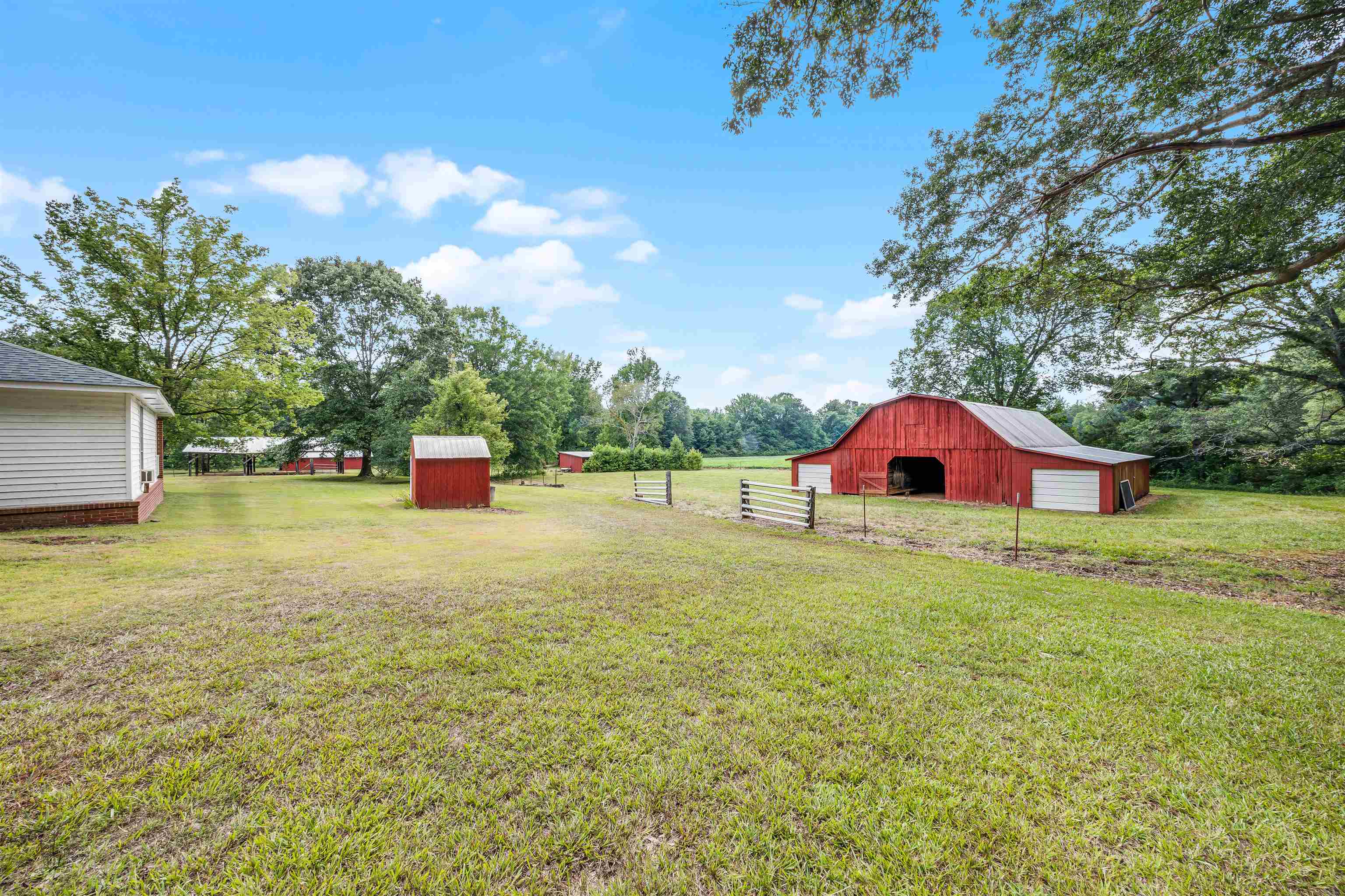 View of yard featuring a rural view and an outdoor structure