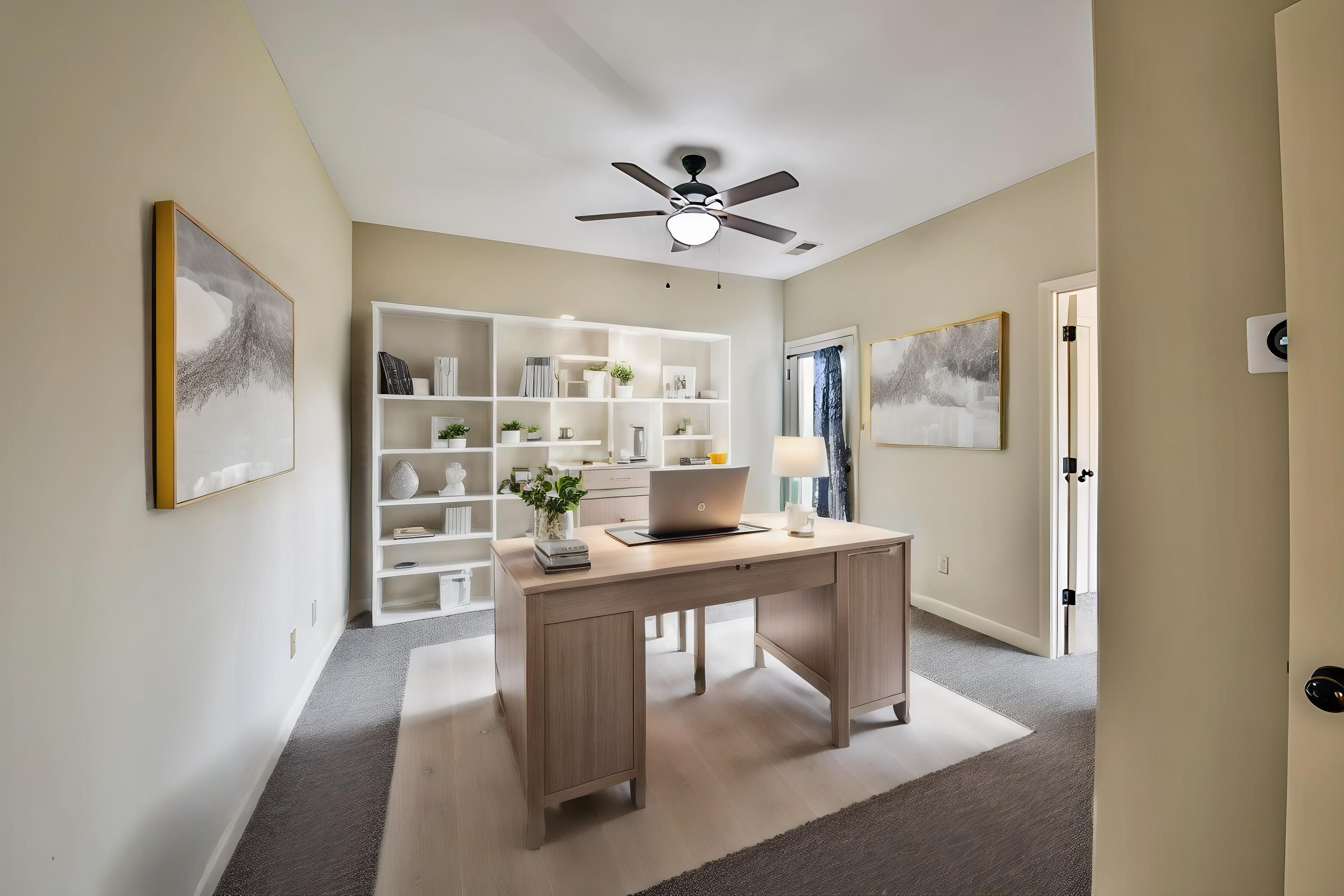 Carpeted office space with ceiling fan