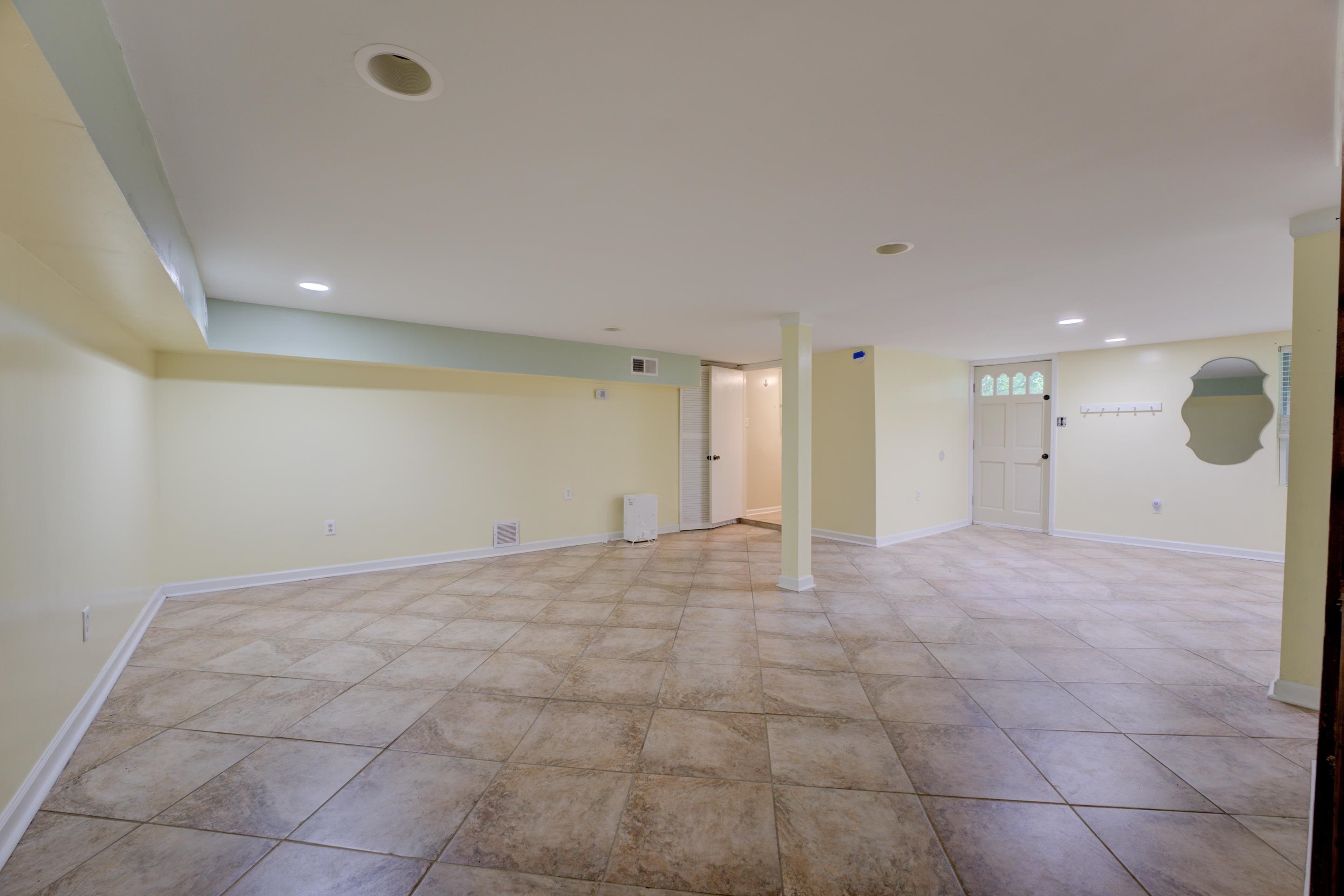 Empty room featuring light tile patterned floors