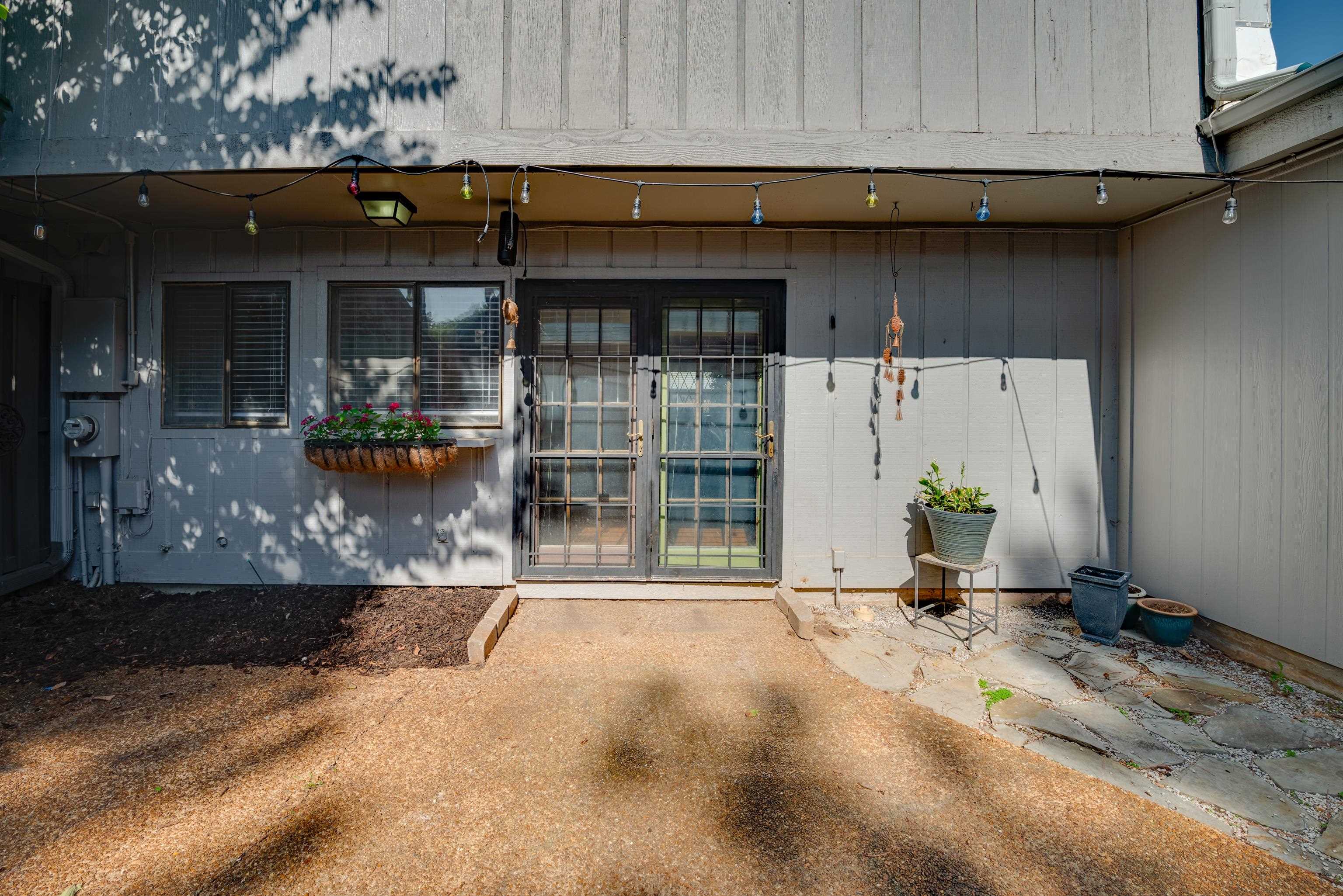 View of exterior entry with french doors and back patio