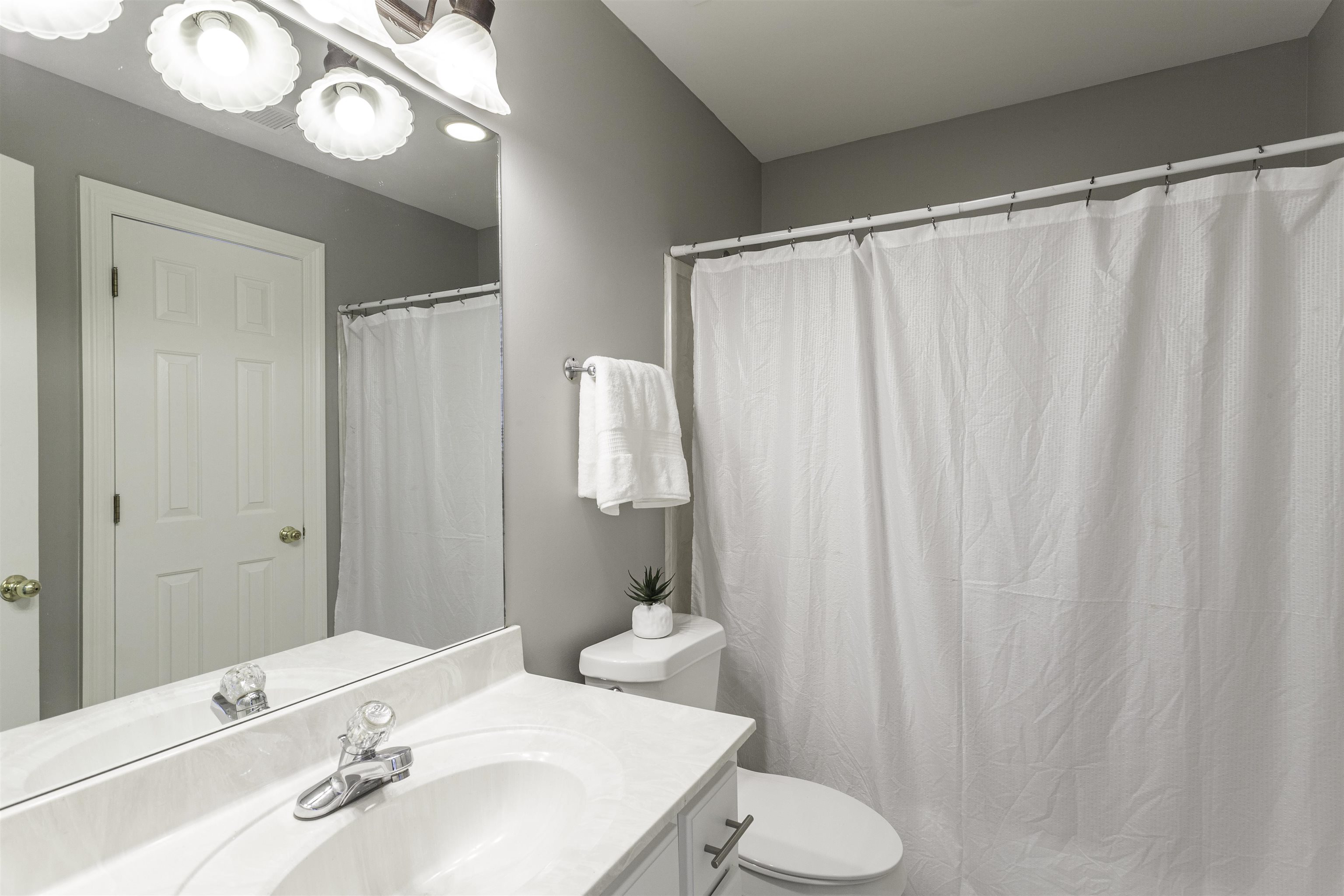 Bathroom with vanity and toilet