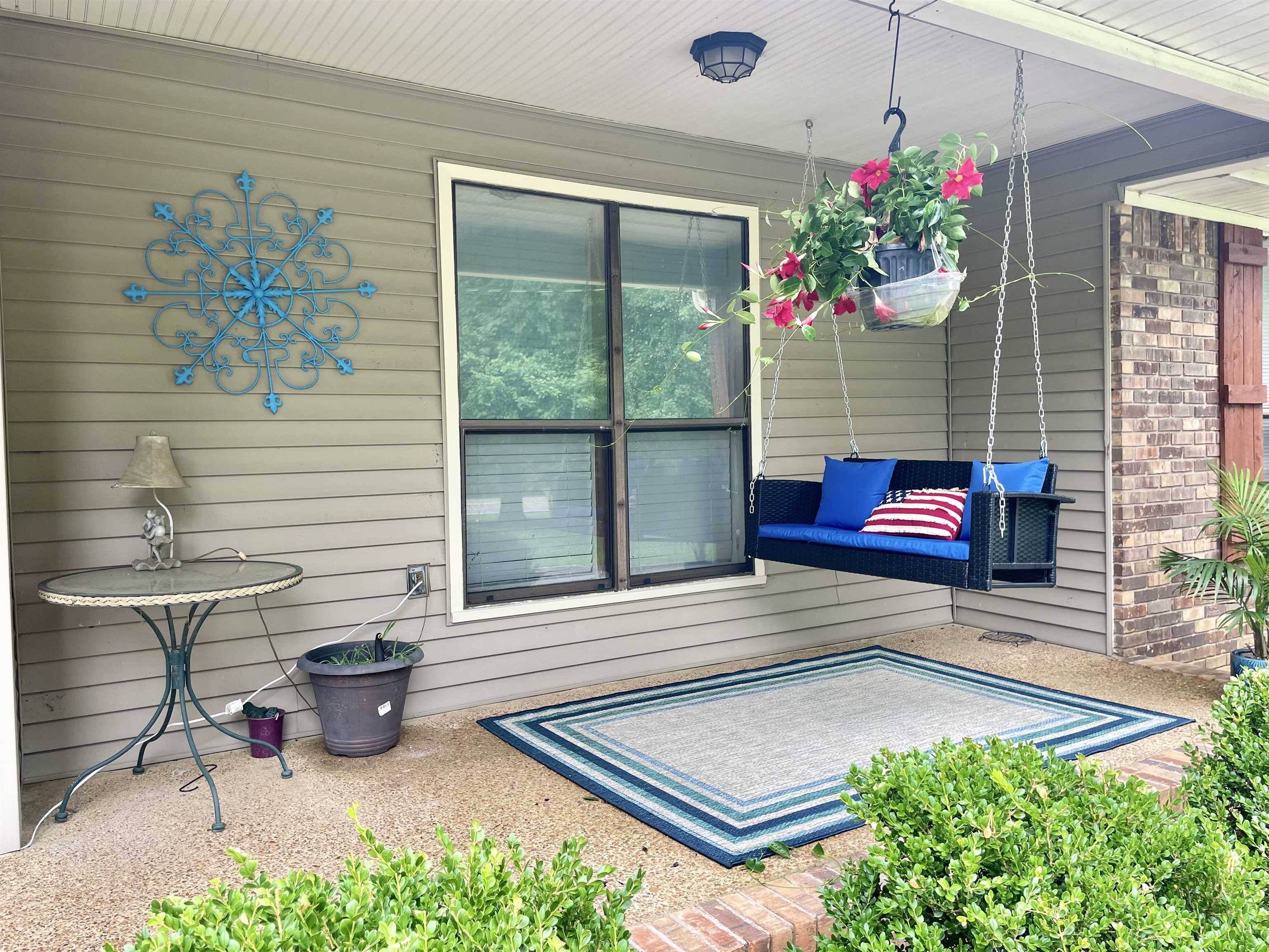 Swing awhile on this large front porch