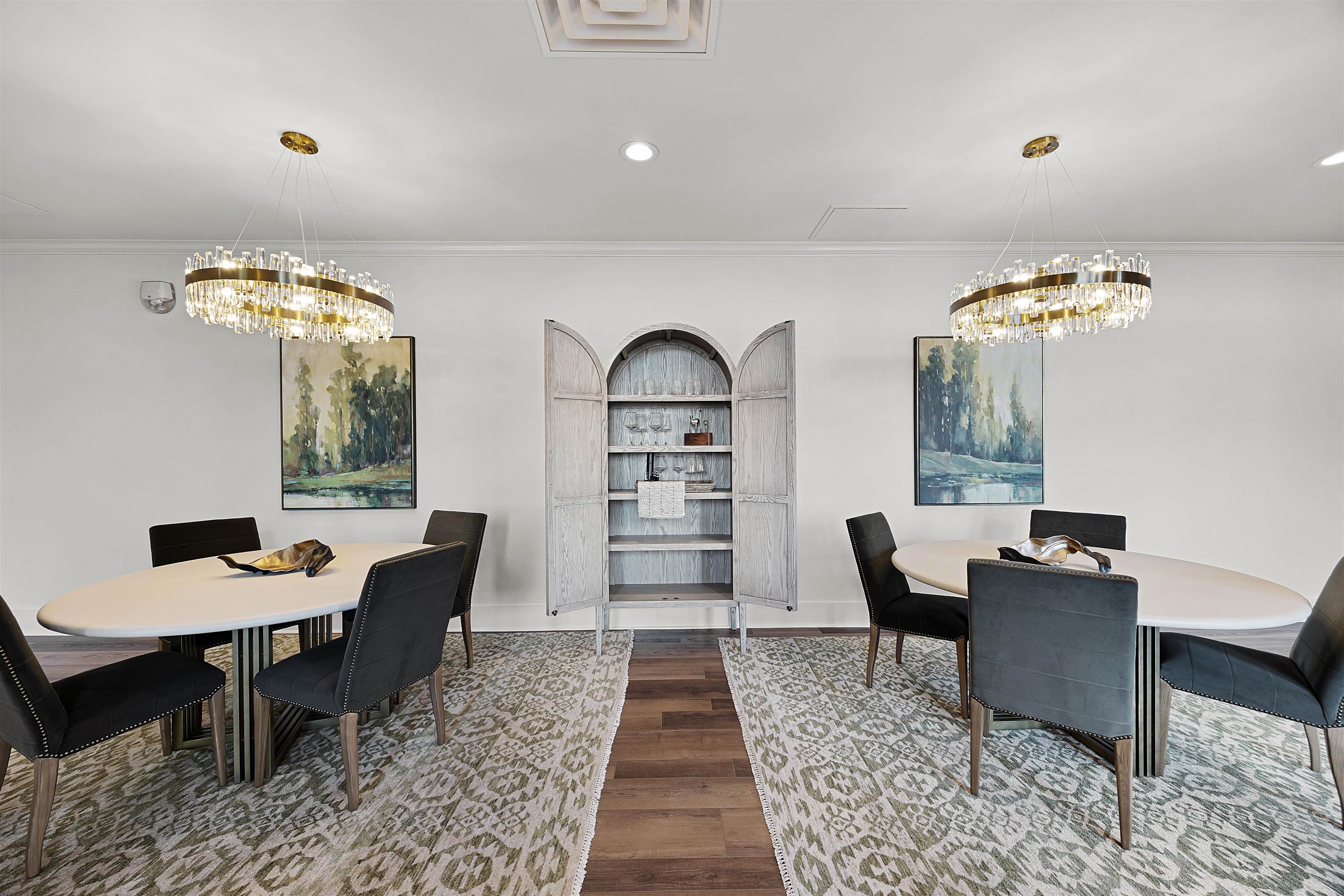 Dining room featuring an inviting chandelier, dark wood-type flooring, and ornamental molding