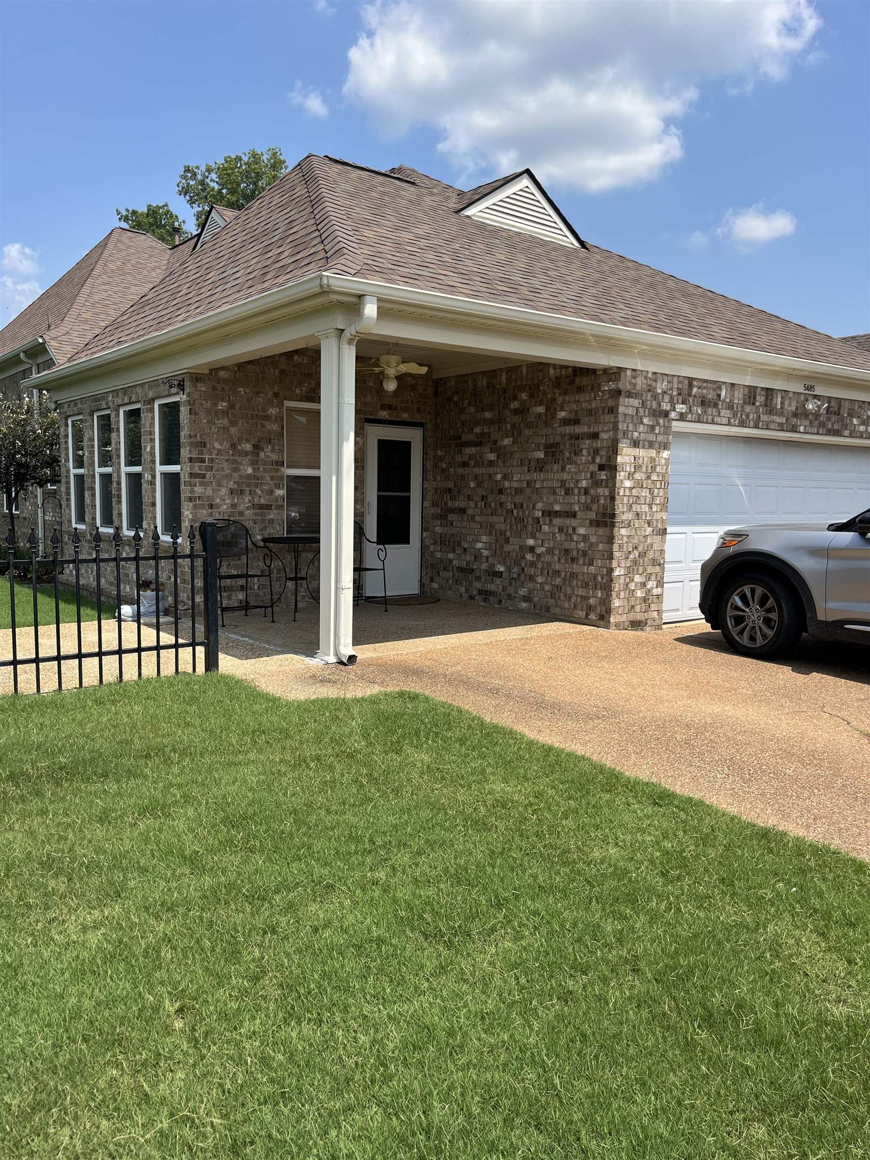 Exterior space featuring a garage and a yard