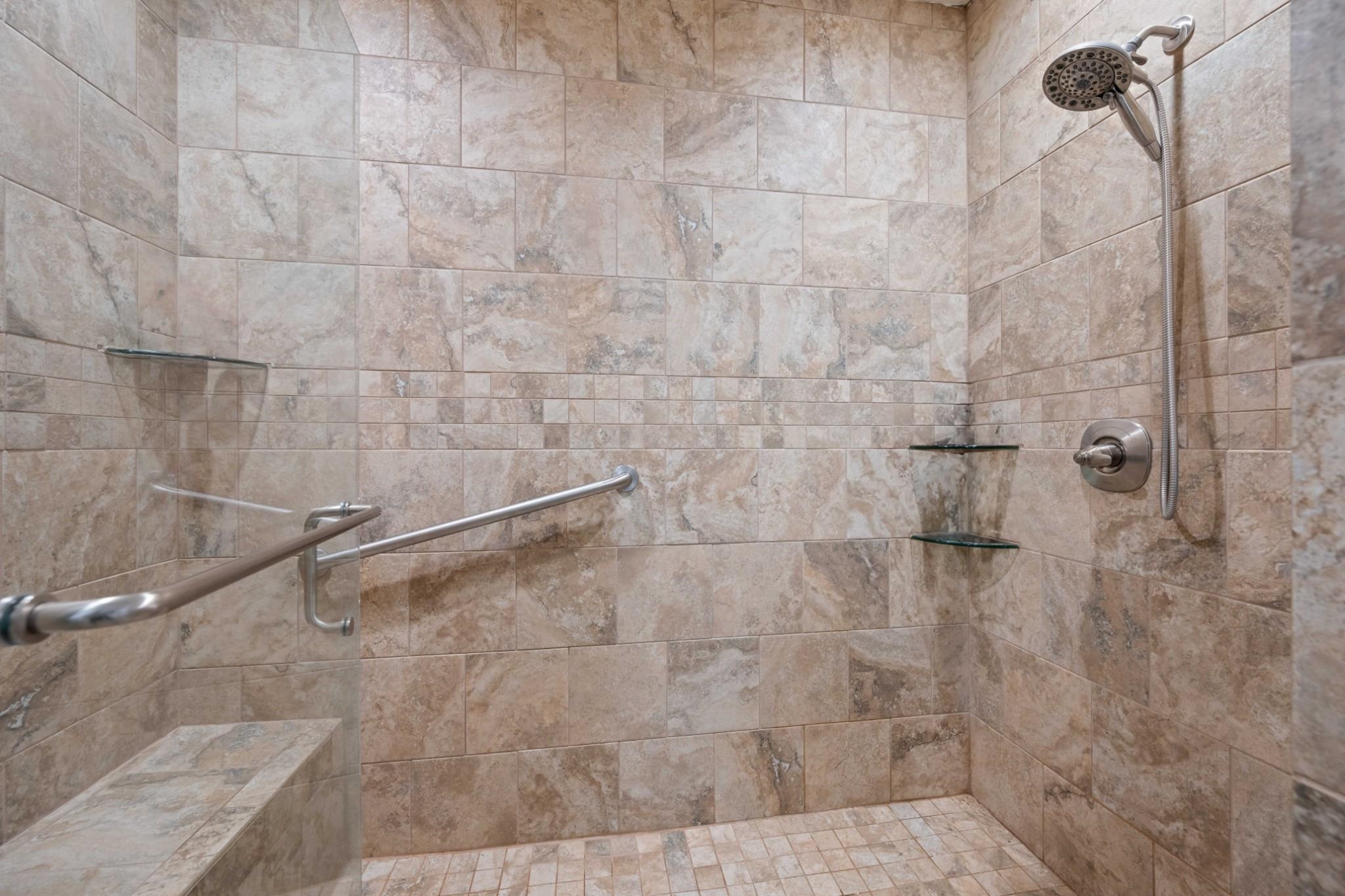 Bathroom featuring tiled shower