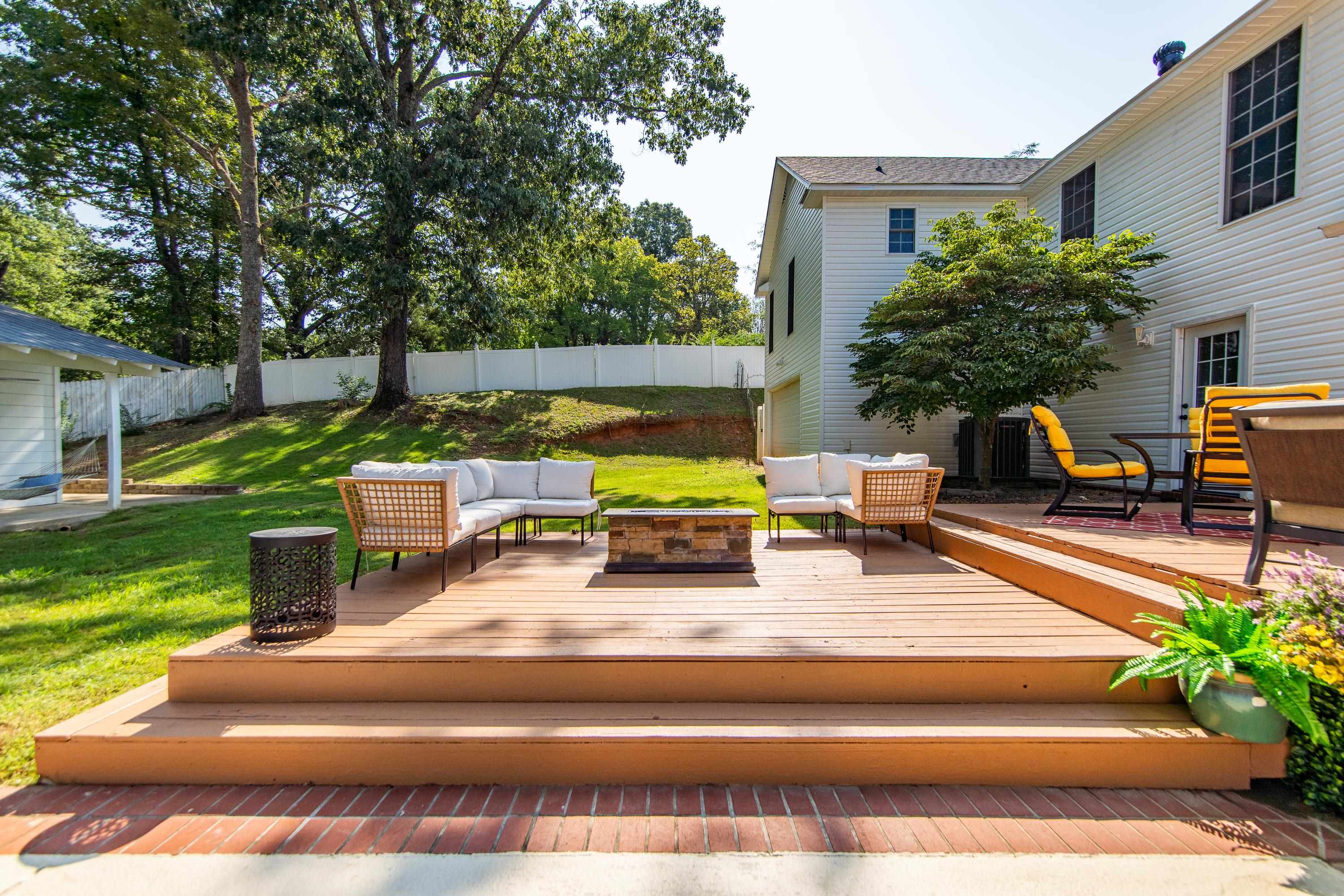 Deck with a yard and outdoor lounge area