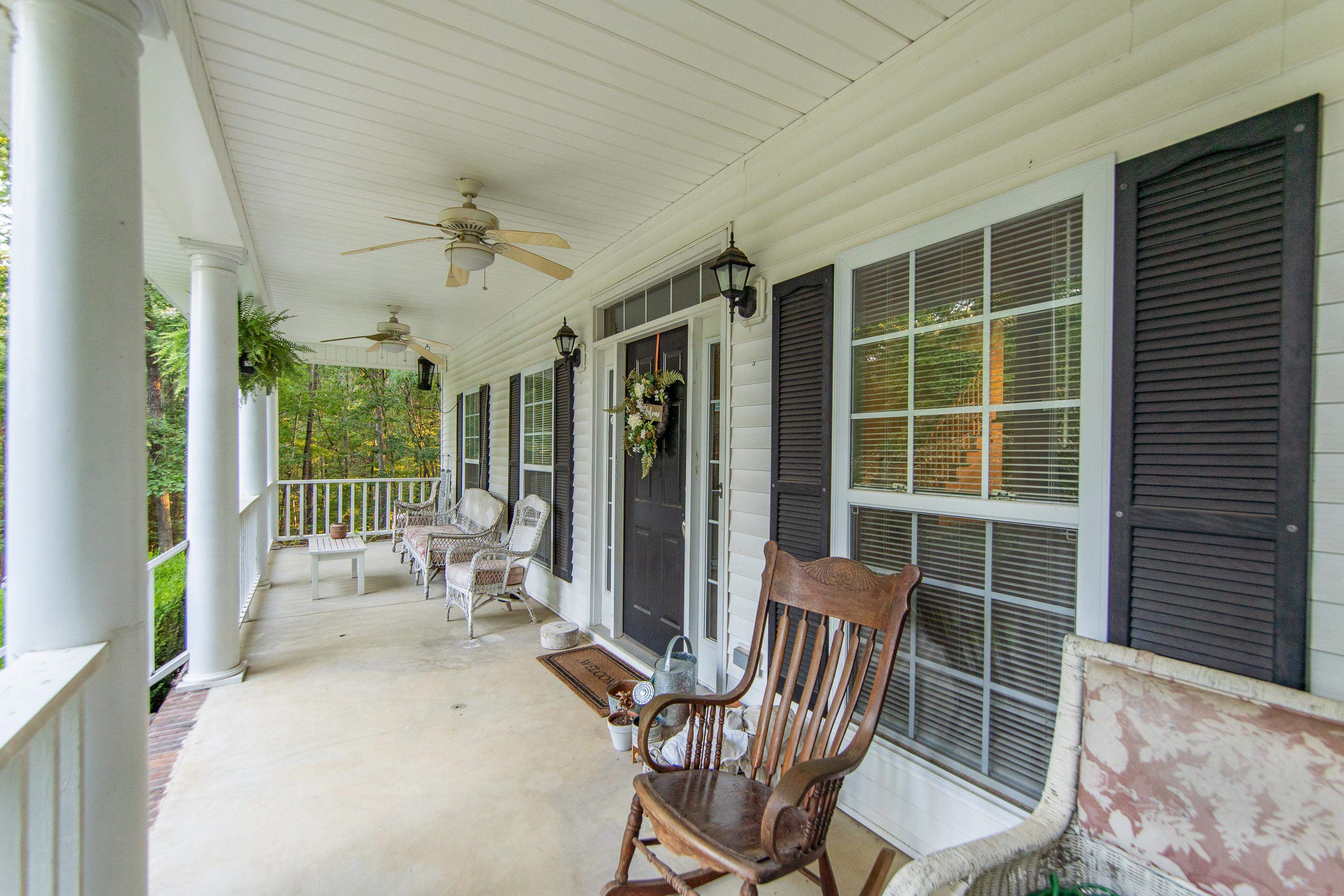 View of patio featuring a porch and ceiling fan