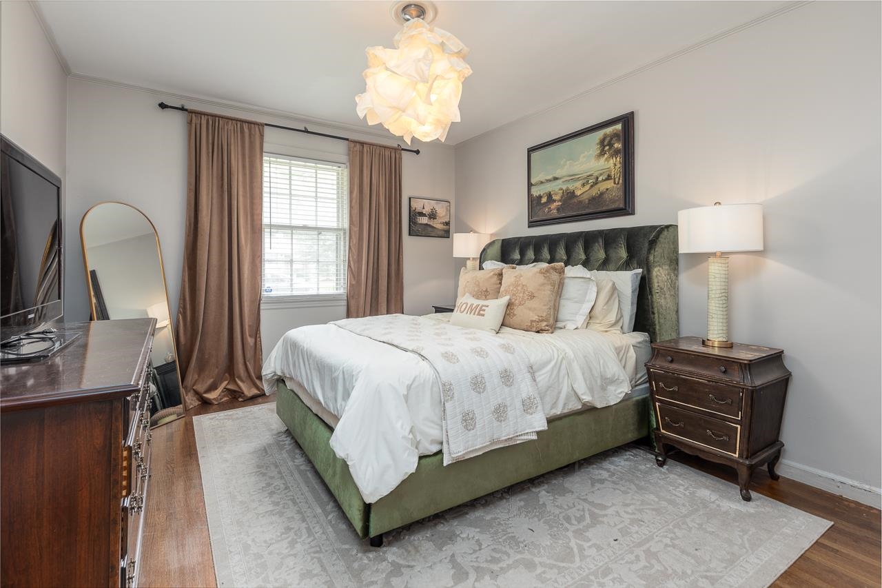 Bedroom with hardwood / wood-style floors