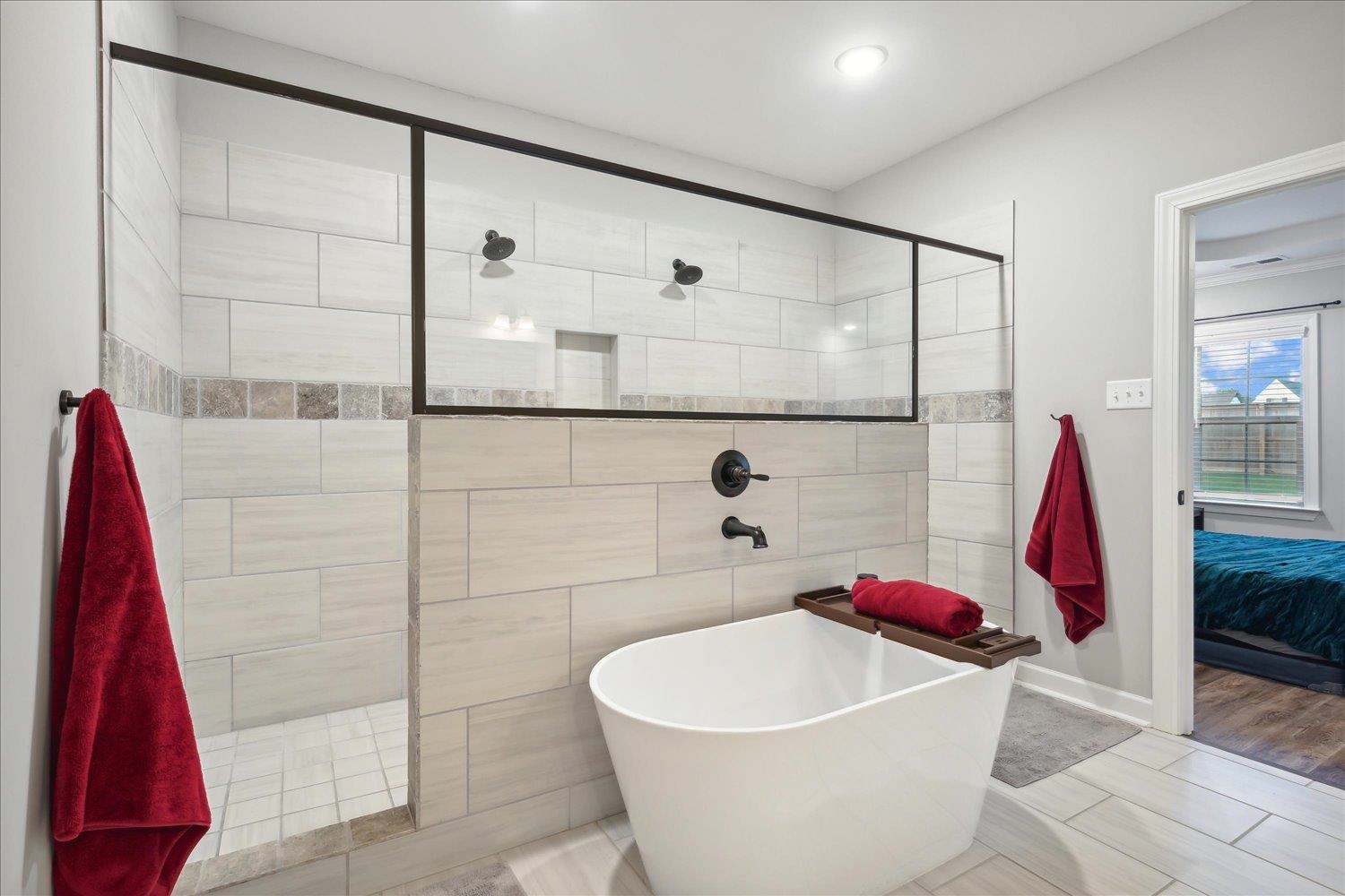 Bathroom with independent shower and bath and wood-type flooring