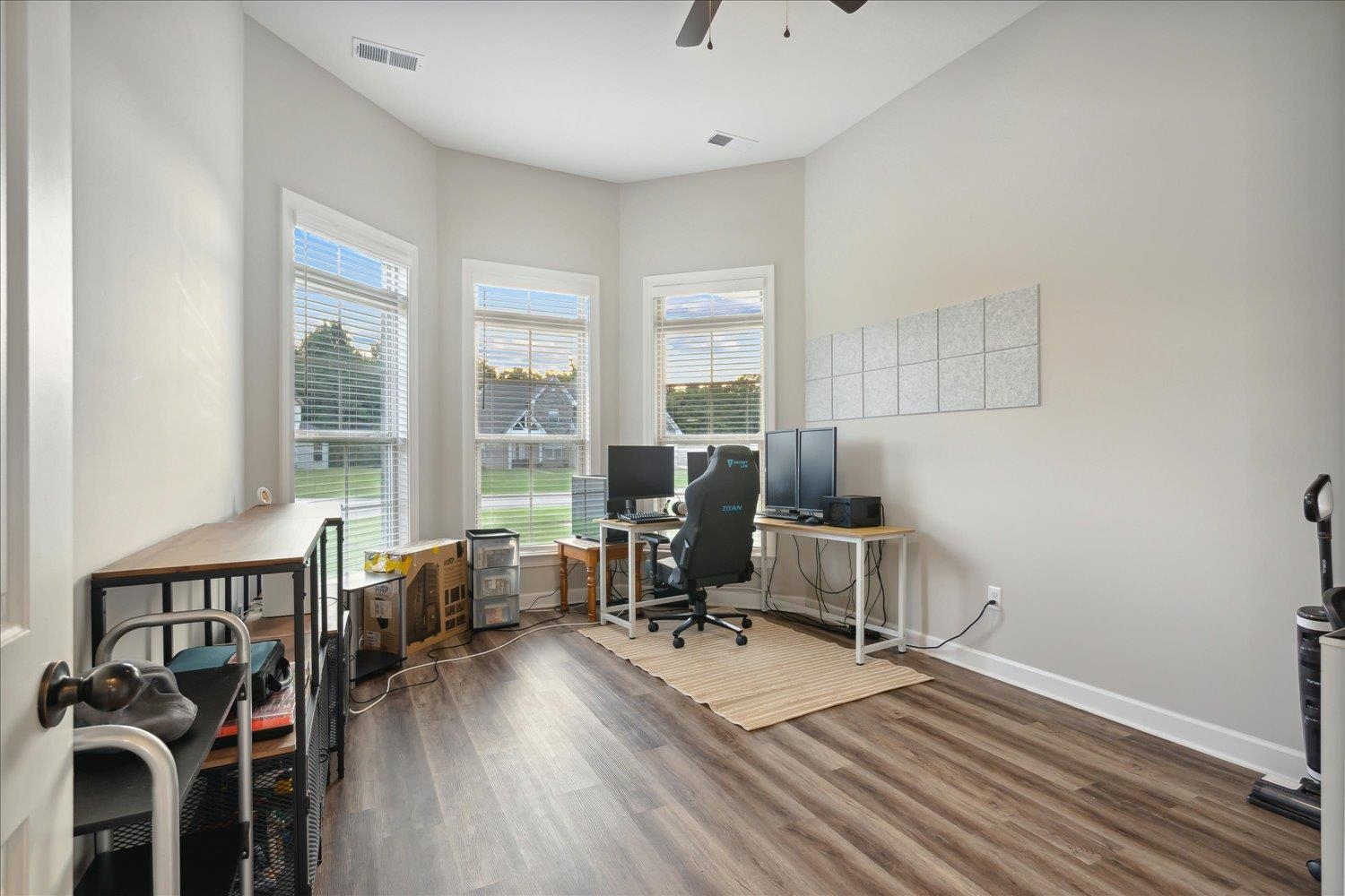 Office space featuring wood-type flooring and ceiling fan