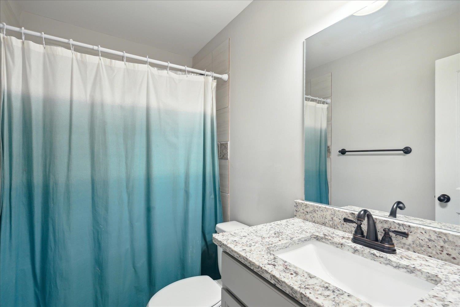 Bathroom featuring toilet and vanity