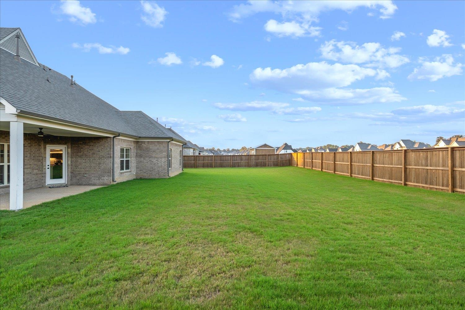 View of yard featuring a patio and ceiling fan