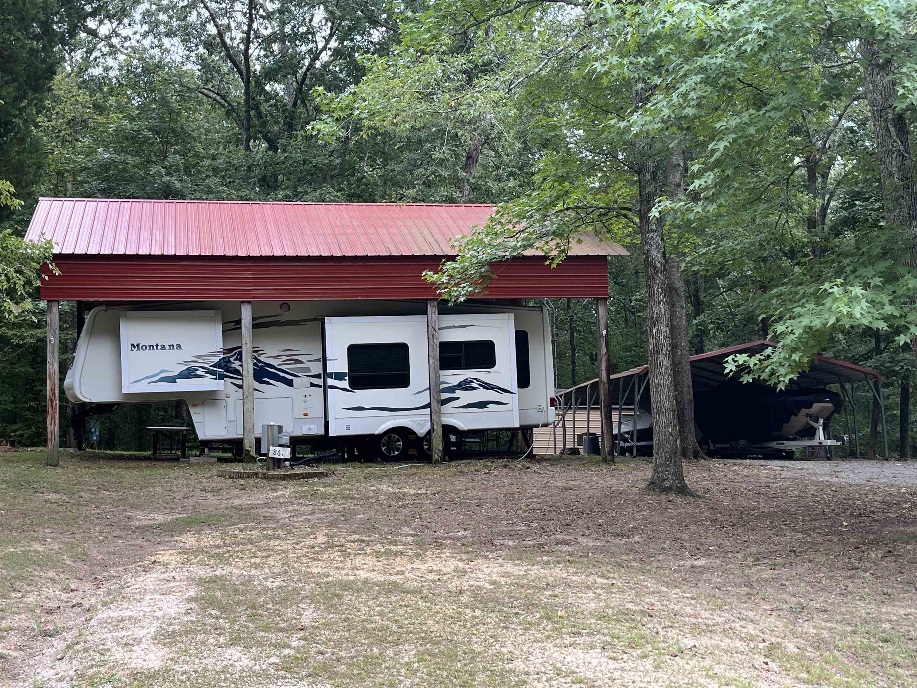 View of outdoor structure with a carport