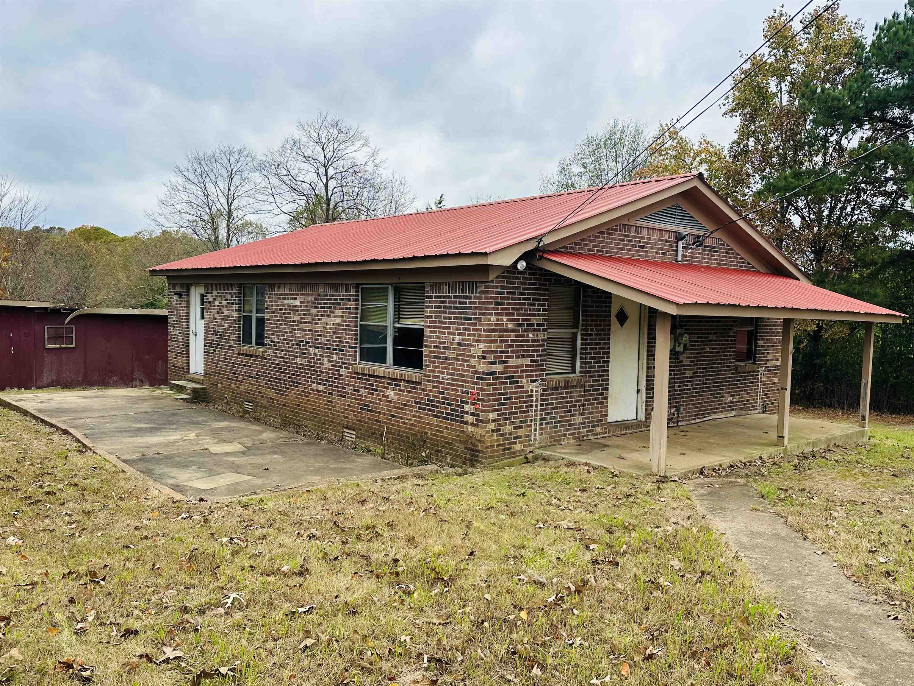 View of yard with a carport
