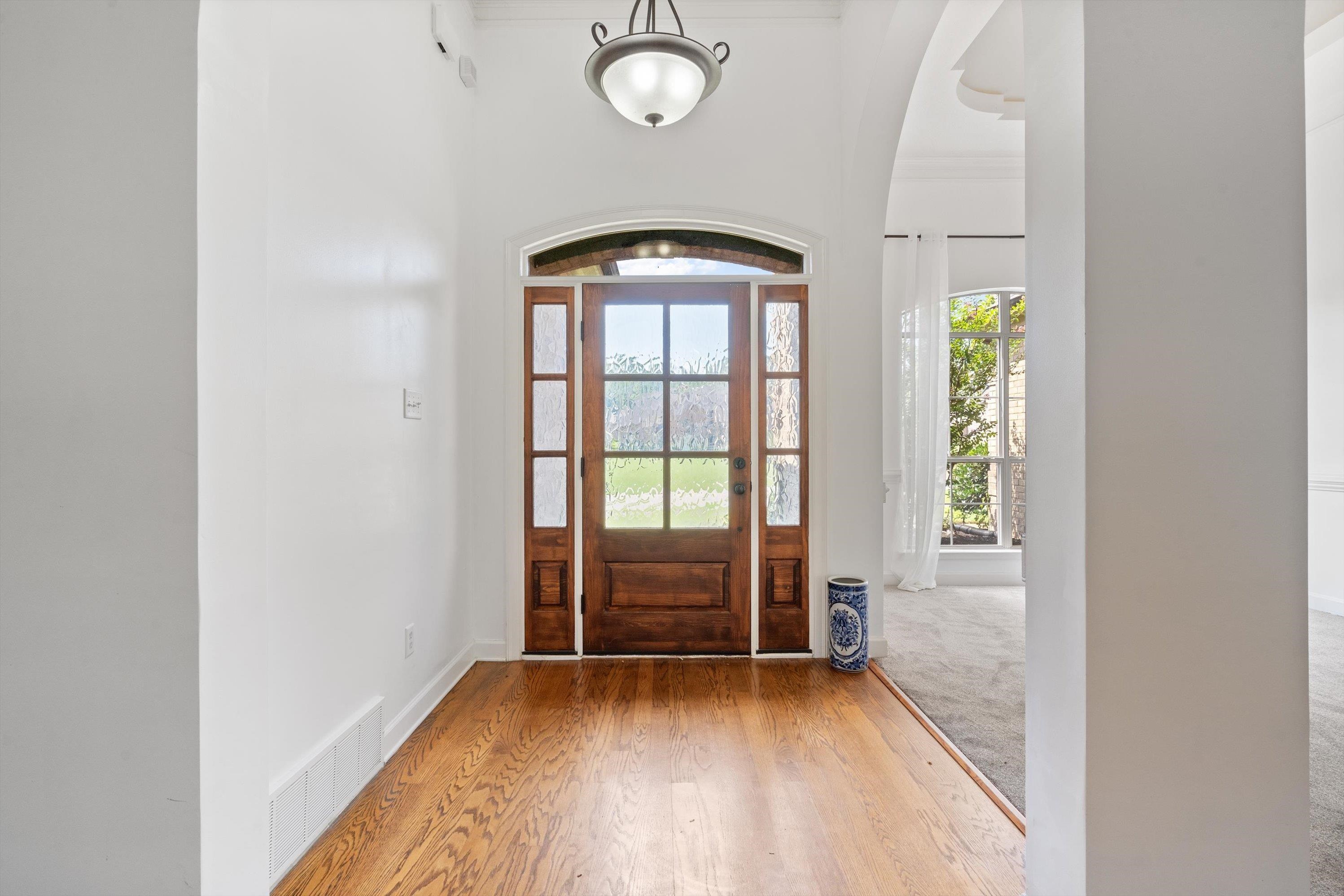 Foyer entrance with hardwood / wood-style flooring