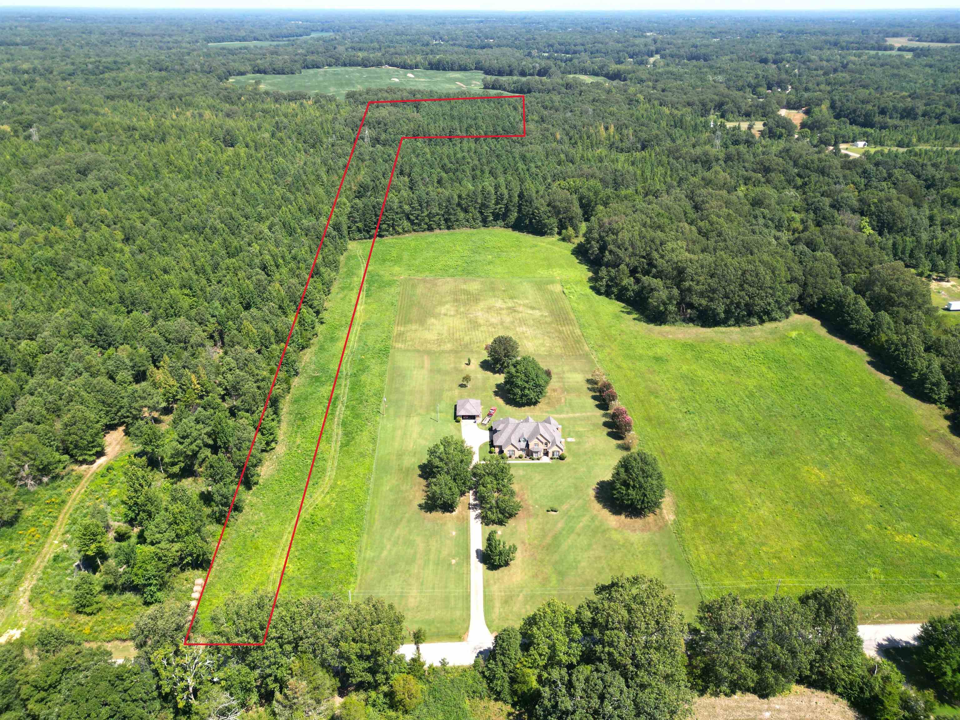 Birds eye view of property featuring a rural view
