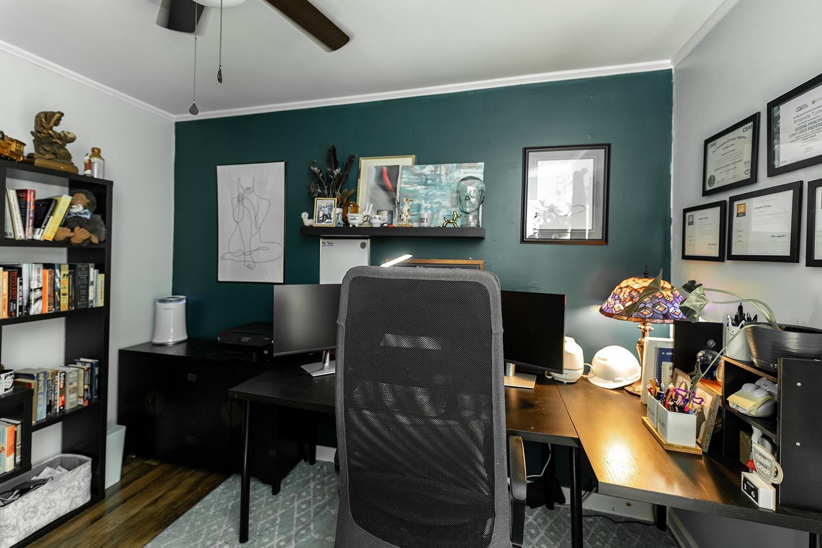 Office area featuring ceiling fan, wood-type flooring, and ornamental molding