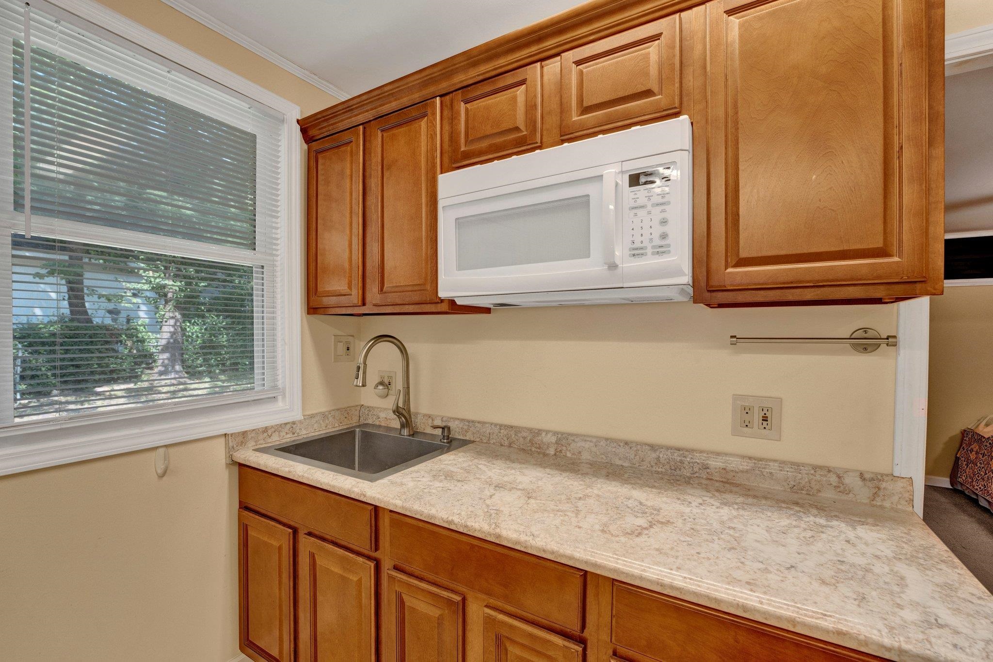 Kitchen with sink and ornamental molding