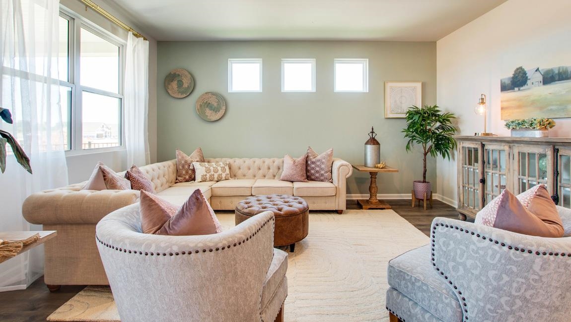 Living room featuring wood-type flooring and plenty of natural light