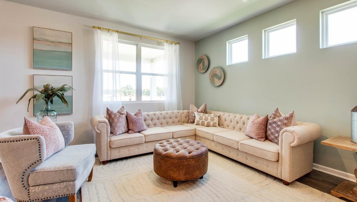 Living room featuring hardwood / wood-style flooring and a wealth of natural light