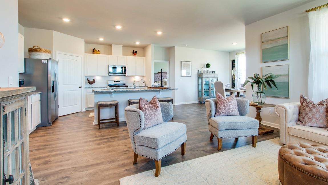 Living room with sink and hardwood / wood-style floors