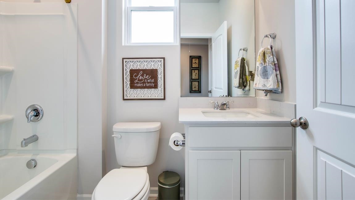 Full bathroom with shower / bathtub combination, toilet, and vanity