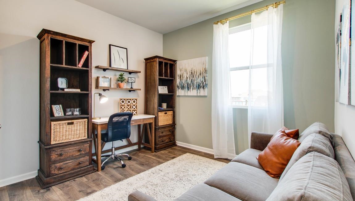 Office space with wood-type flooring and a wealth of natural light
