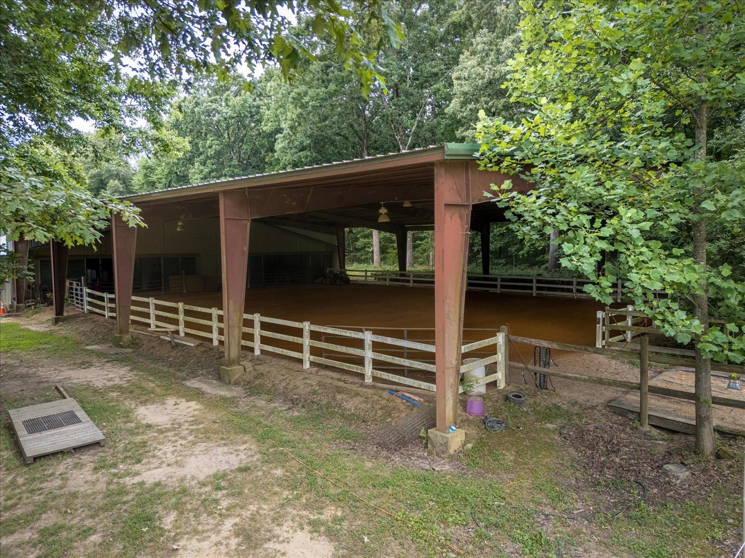 View of side of home featuring an outbuilding