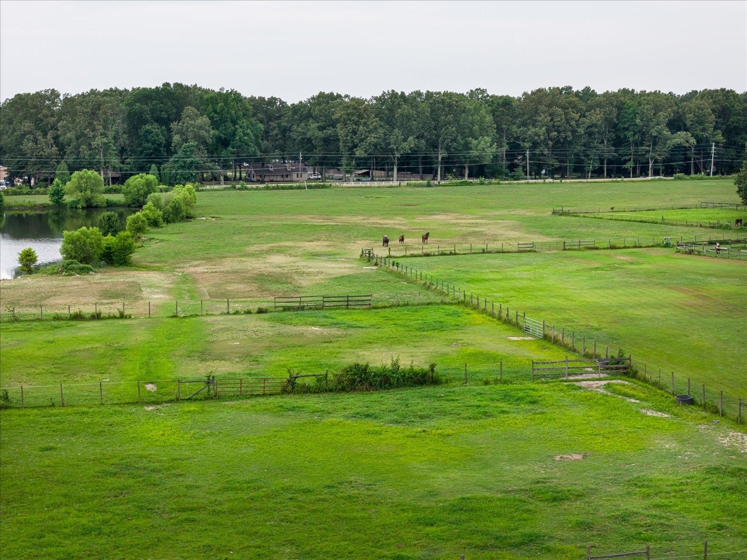 View of community featuring a rural view and a lawn