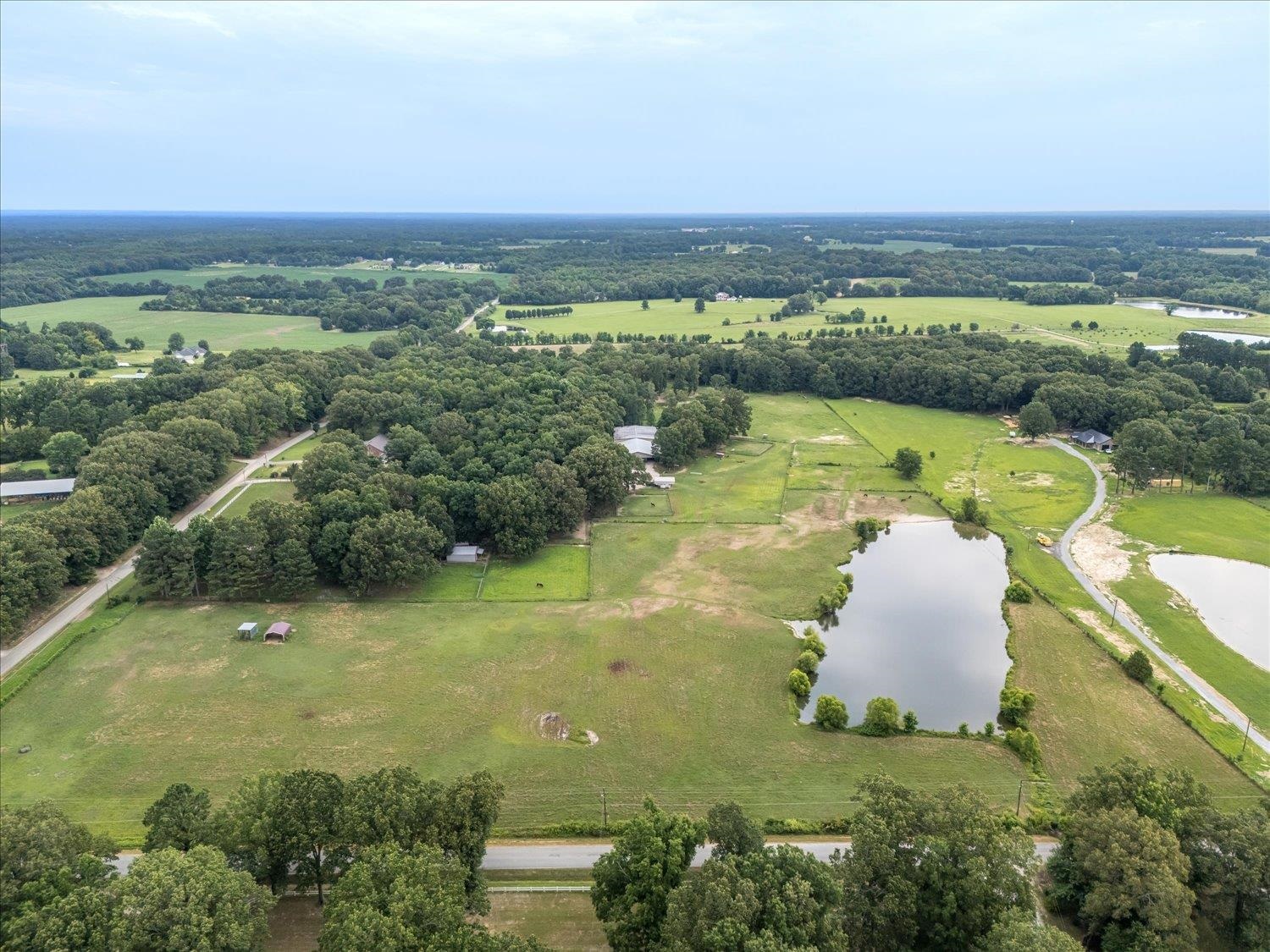 Drone / aerial view featuring a rural view and a water view