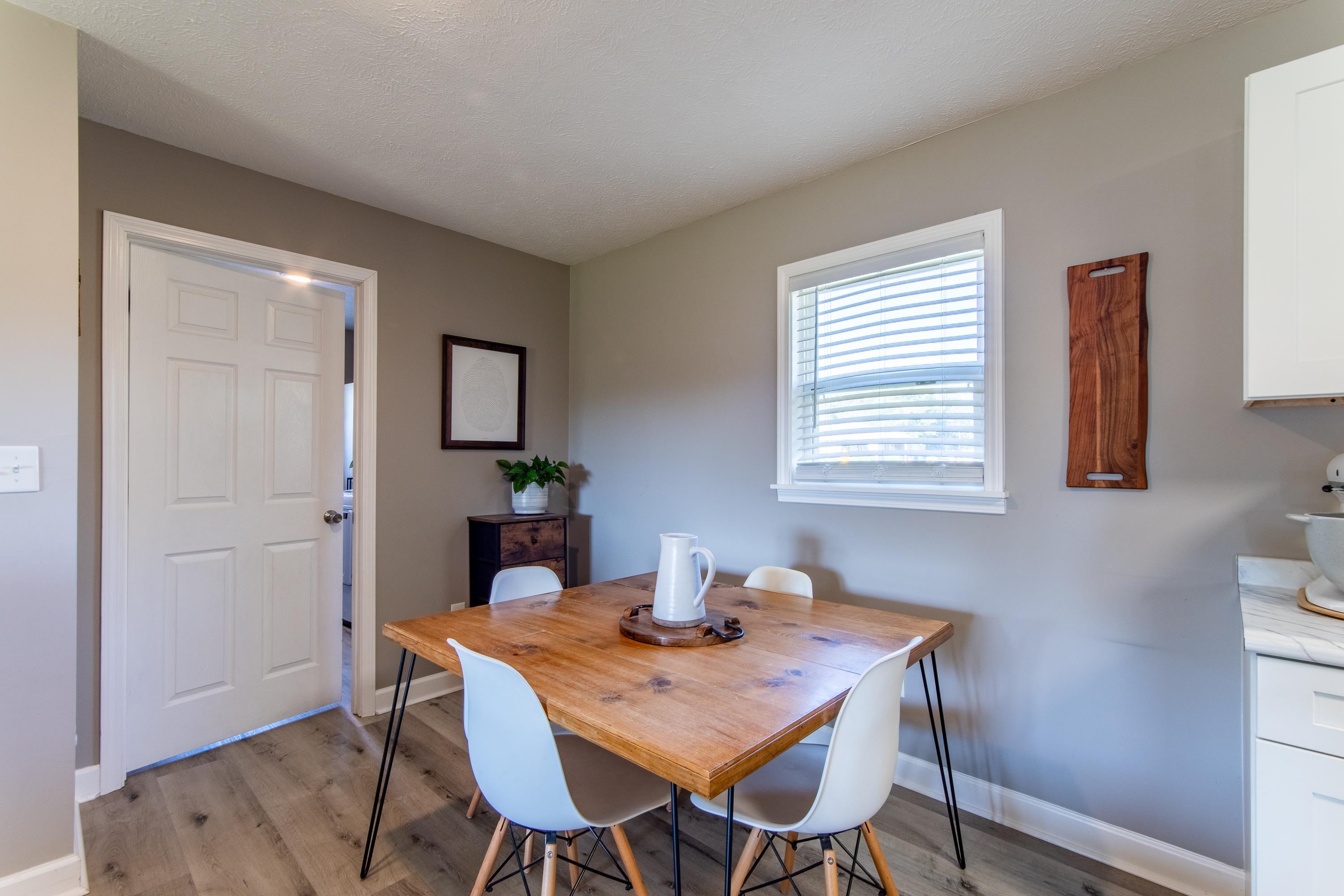 Dining area with light hardwood / wood-style flooring