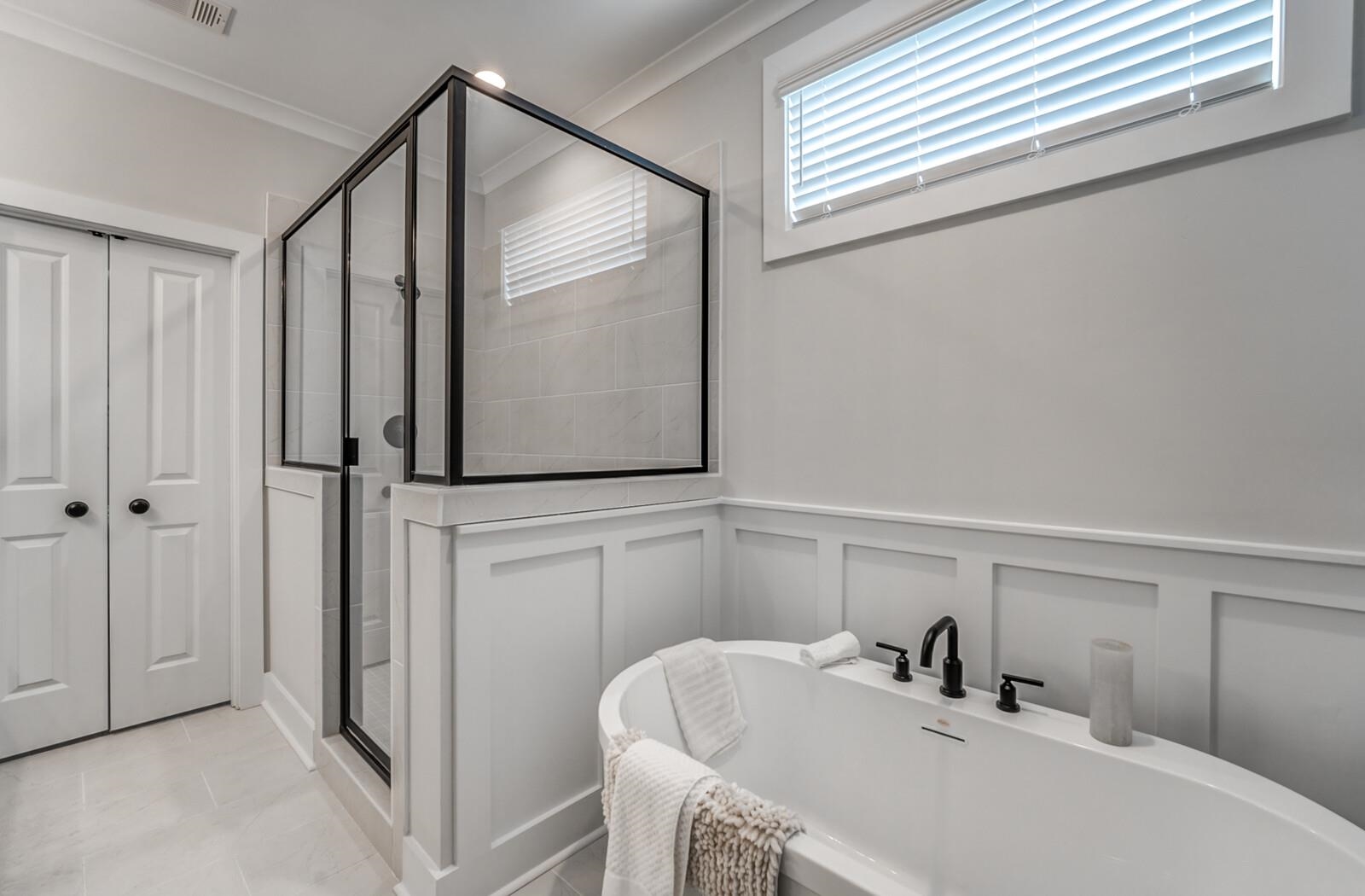 Bathroom with ornamental molding, independent shower and bath, and tile patterned floors