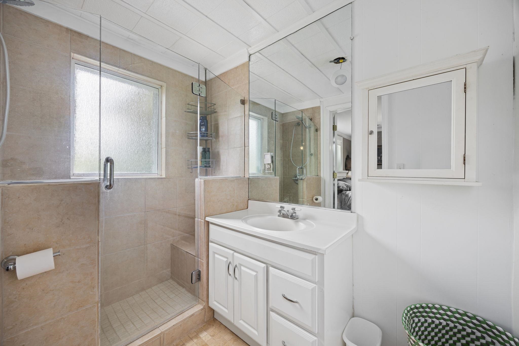Bathroom featuring vanity and walk in shower